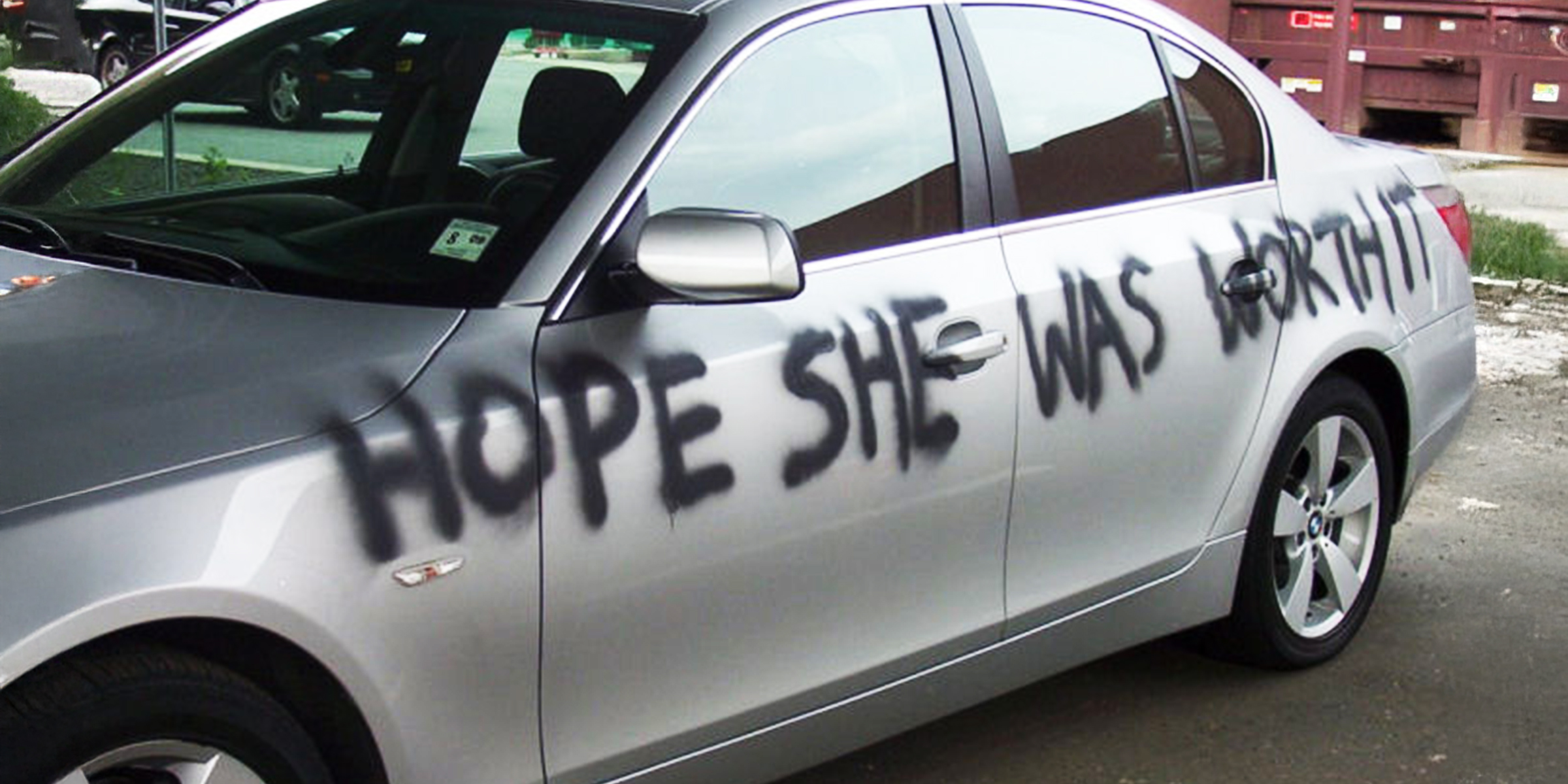 A message spray painted onto a car | Source: Flickr