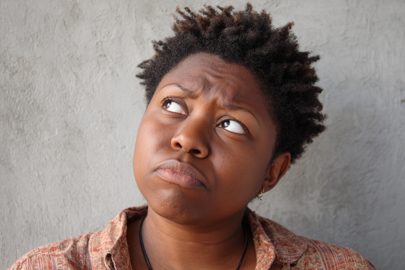 A frowning woman | Source: Midjourney