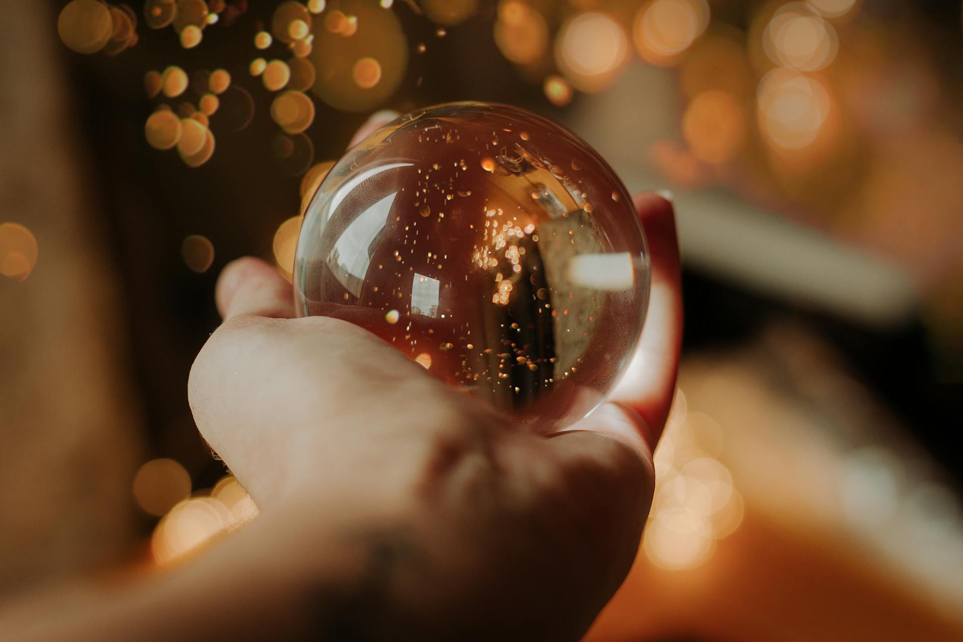 A person holding a snow globe | Source: Pexels