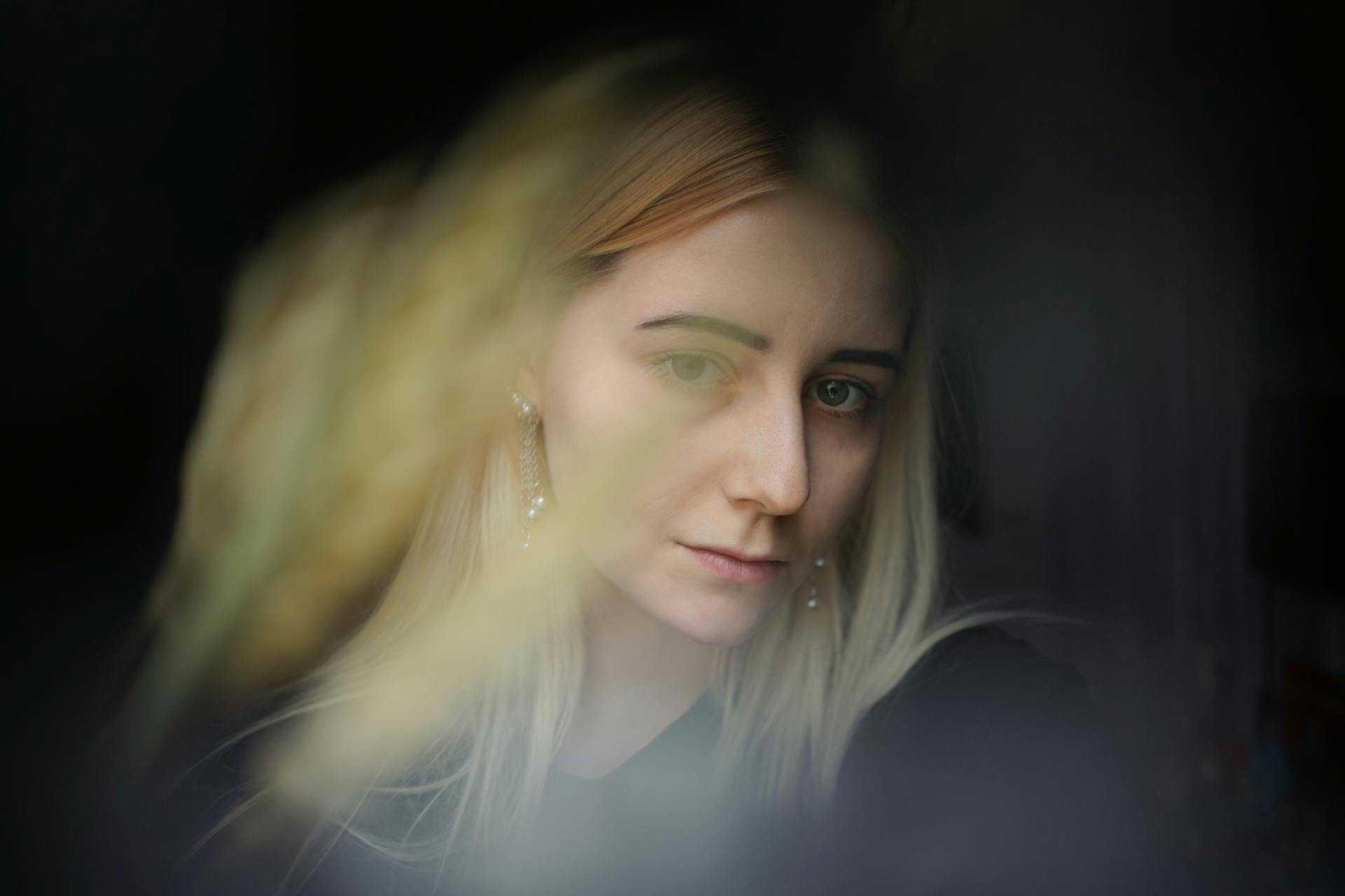 A thoughtful young woman with a soft facial expression | Source: Pexels