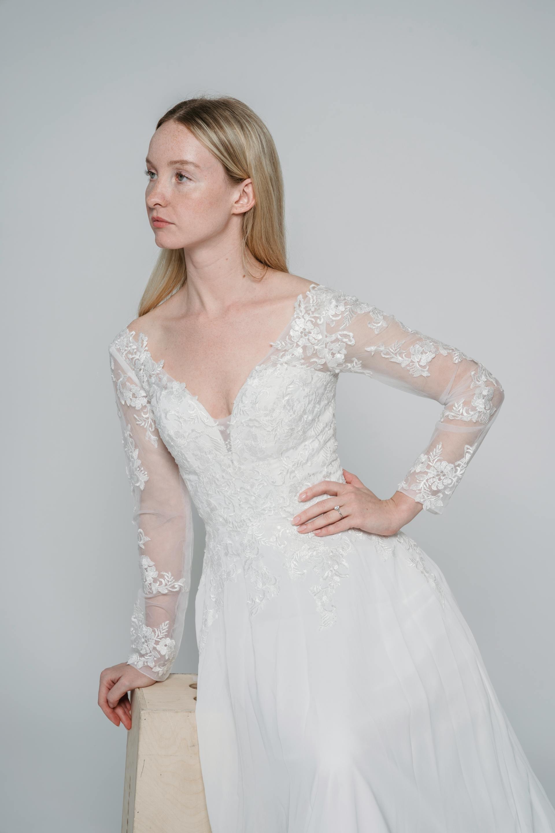 A wearing trying on a wedding dress glaring at someone | Source: Pexels