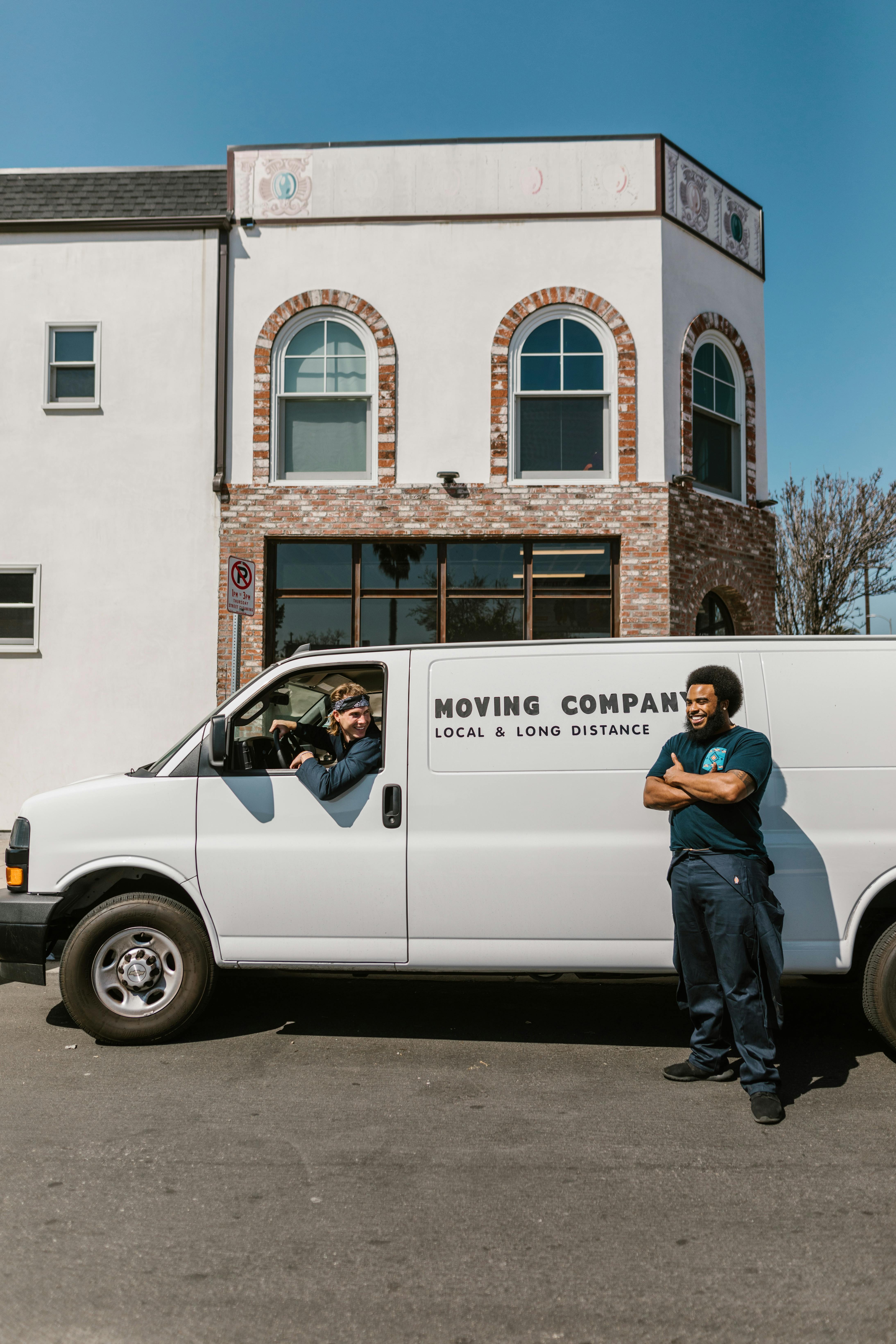 A moving truck with two men | Source: Pexels