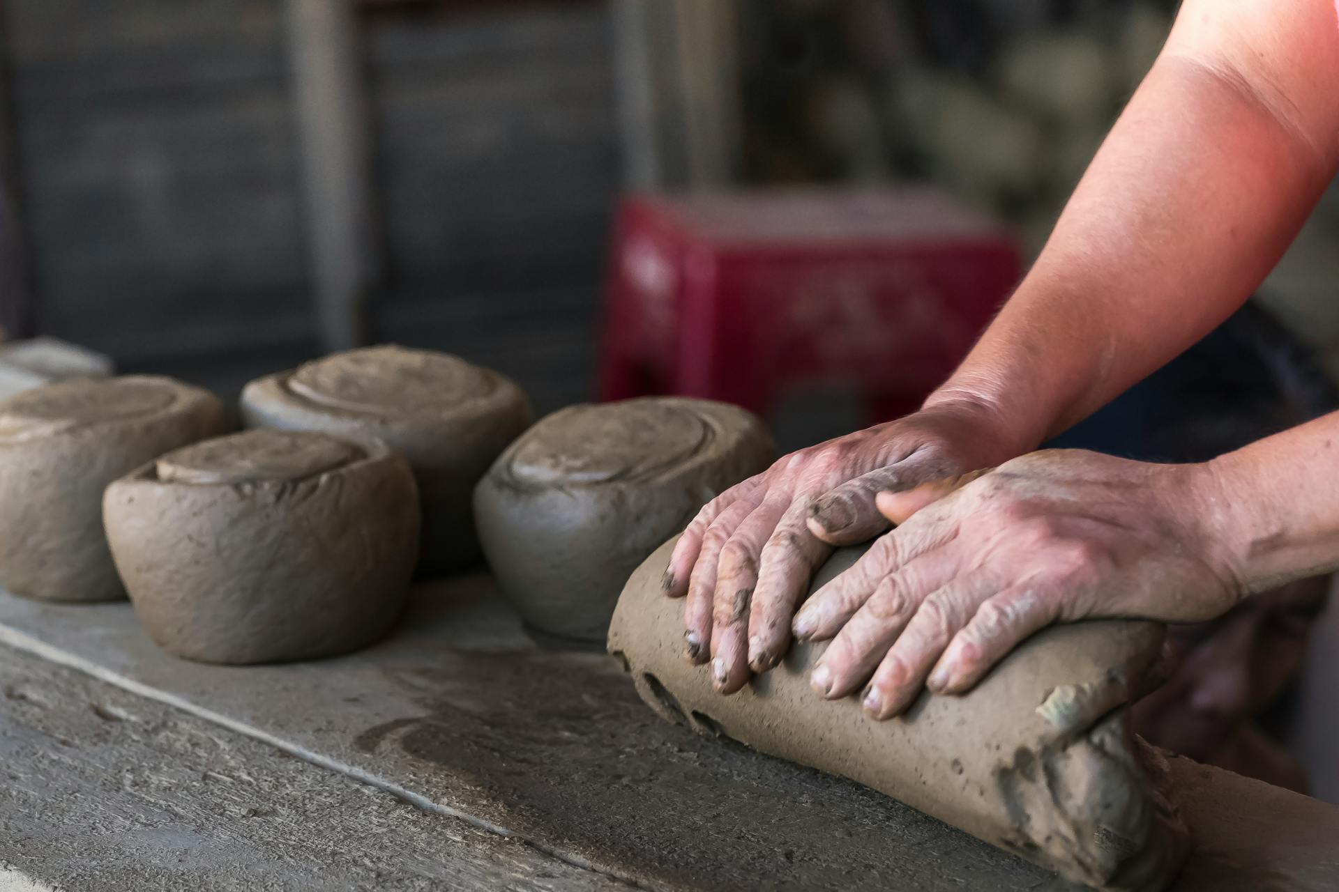 A person gathering clay | Source: Pexels