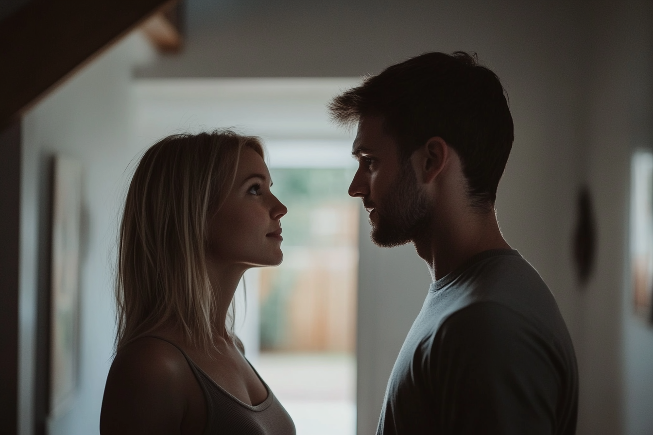 Two people standing in an entrance hall | Source: Midjourney