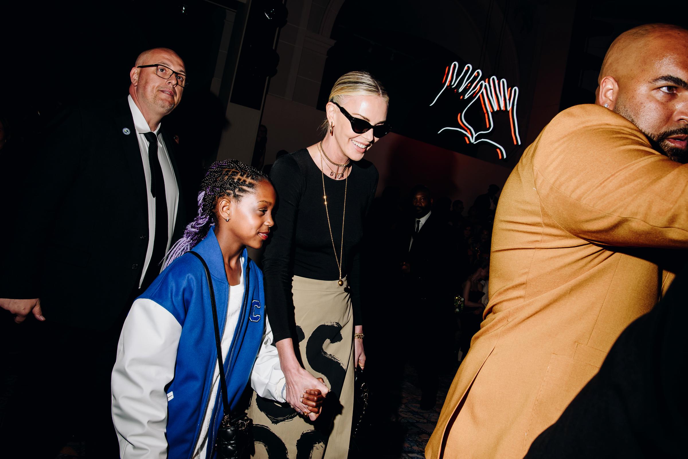 Charlize Theron and her daughter, August Theron, at the Dior Pre-Fall 2024 Show at the Brooklyn Museum in New York, on April 15, 2024. | Source: Getty Images