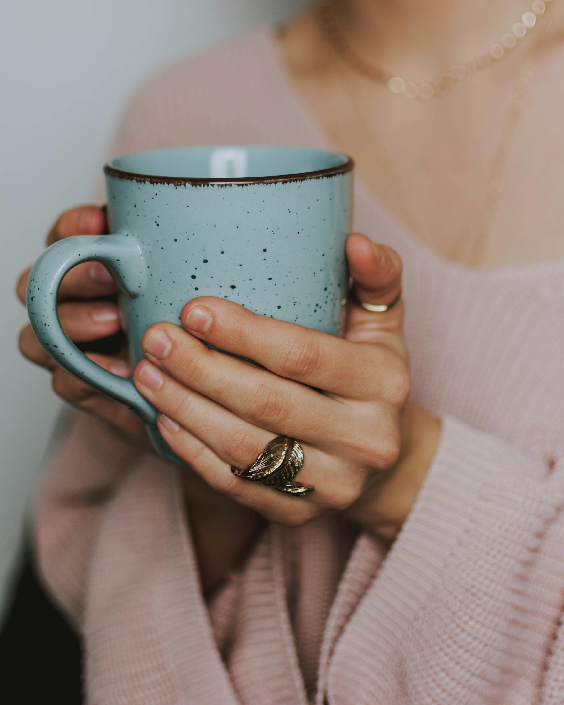 Close-up of a woman holding a mug | Source: Pexels