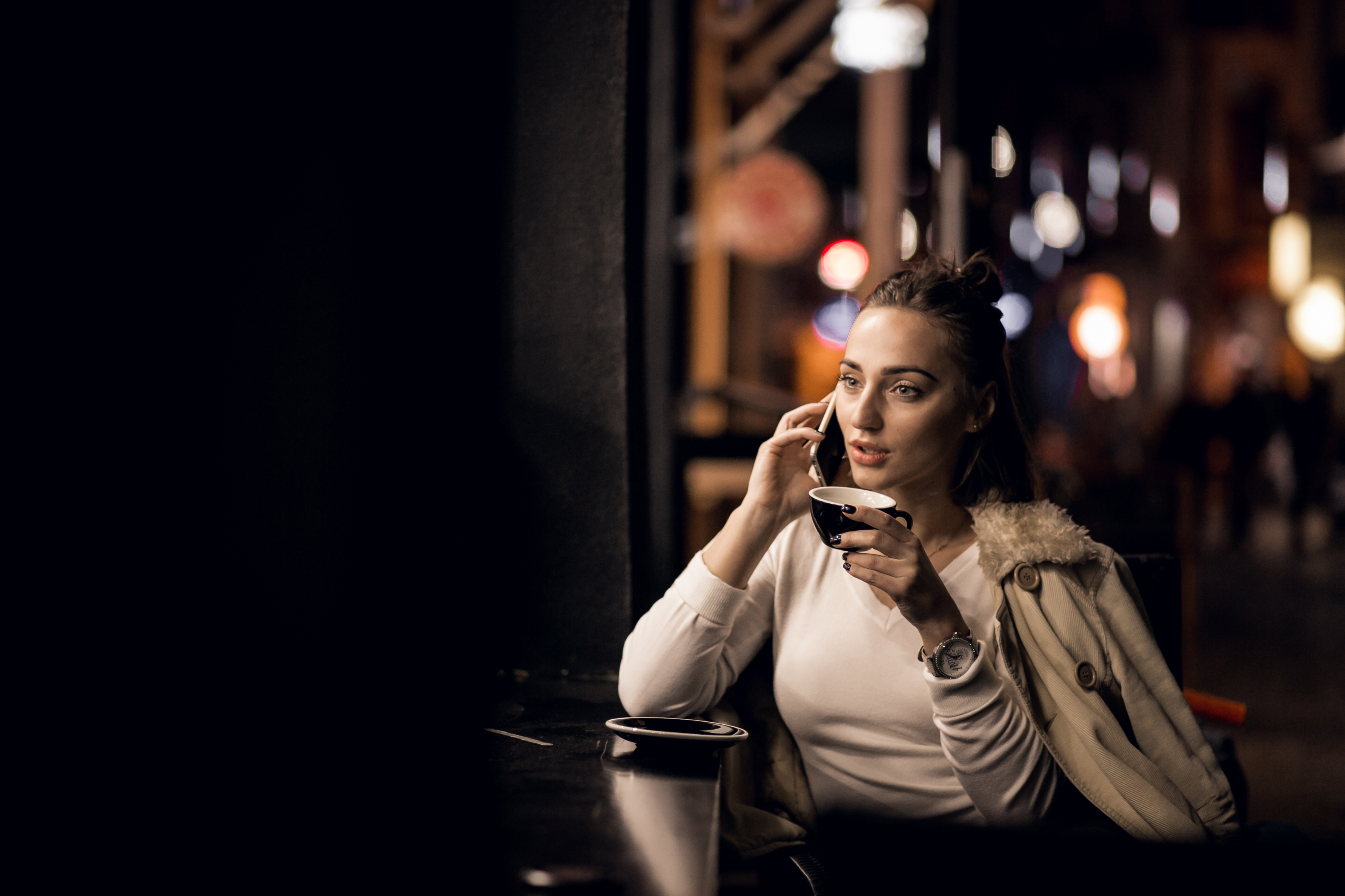 A stunned woman on a call | Source: Freepik