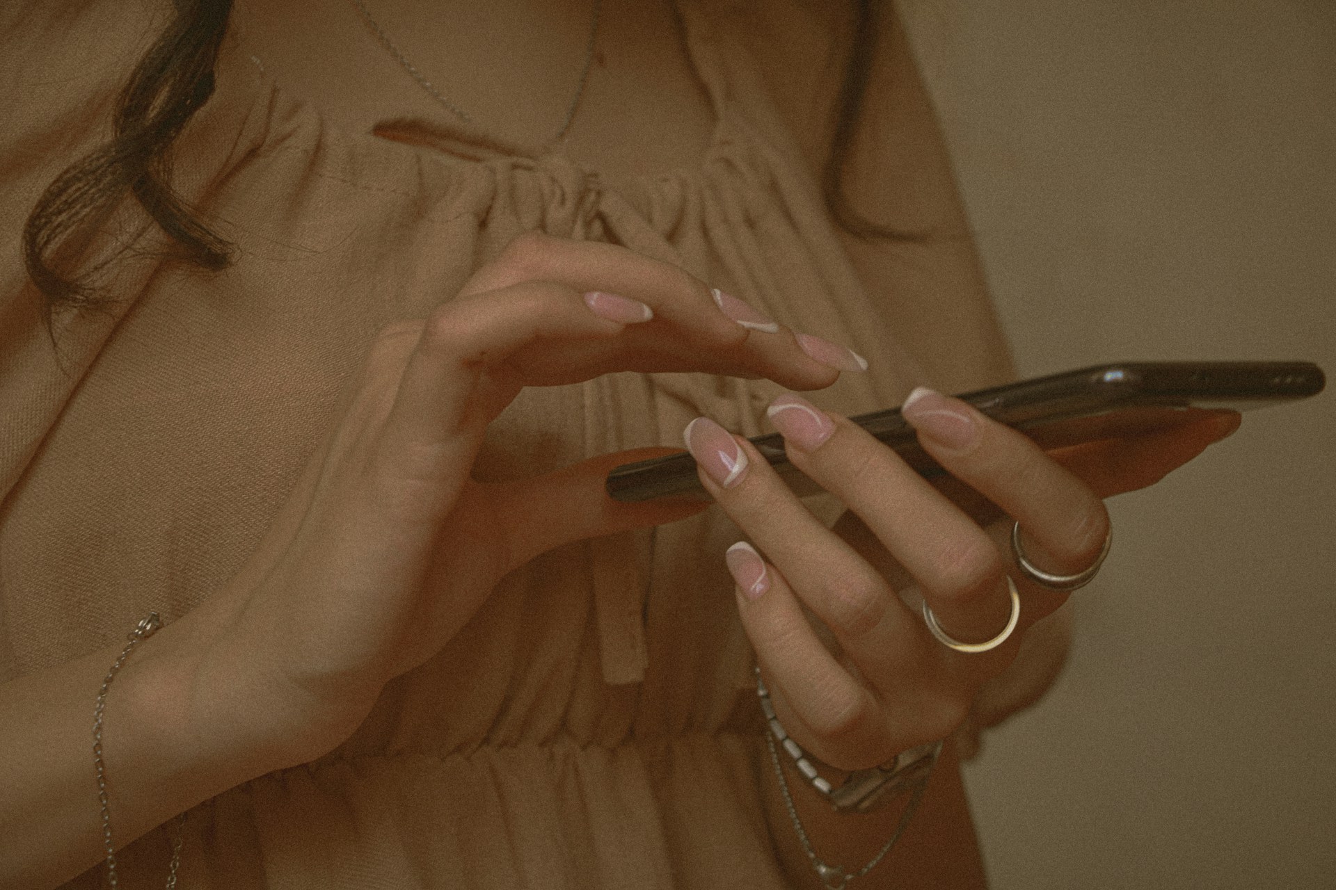 A woman holding her phone | Source: Unsplash