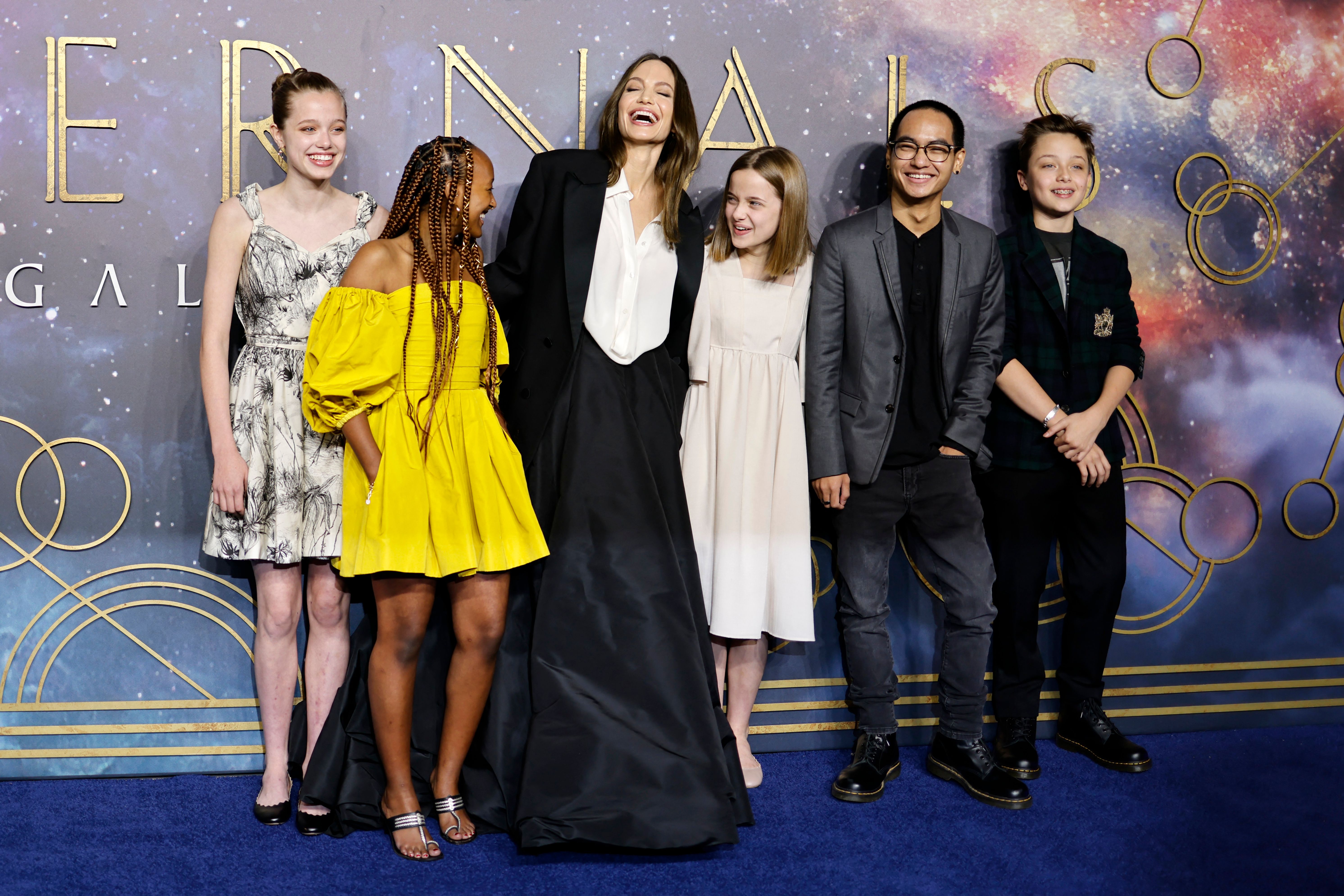 Angelina Jolie poses with her children, Shiloh Jolie-Pitt, Zahara Jolie-Pitt, Vivienne Jolie-Pitt, Maddox Jolie-Pitt and Knox Jolie-Pitton on the blue carpet on arrival to attend the UK Gala Screening of the film “Eternals,” at the BFI IMAX in London on October 27, 2021. | Source: Getty Images