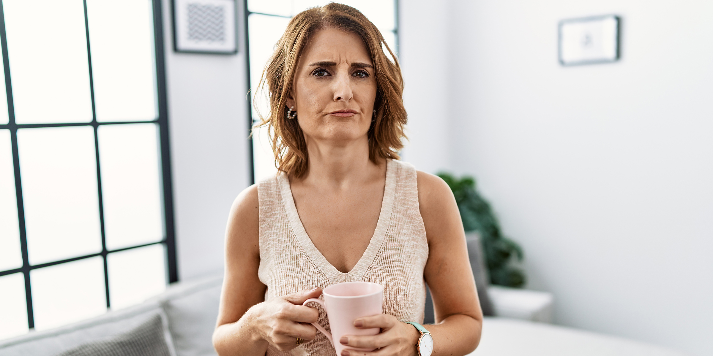 A woman drinking coffee | Source: Shutterstock