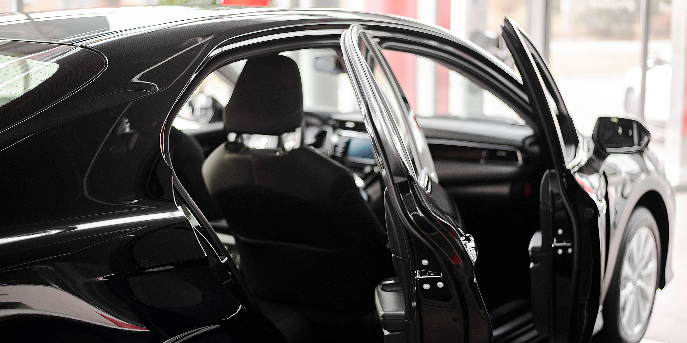 A black car with open doors | Source: Freepik