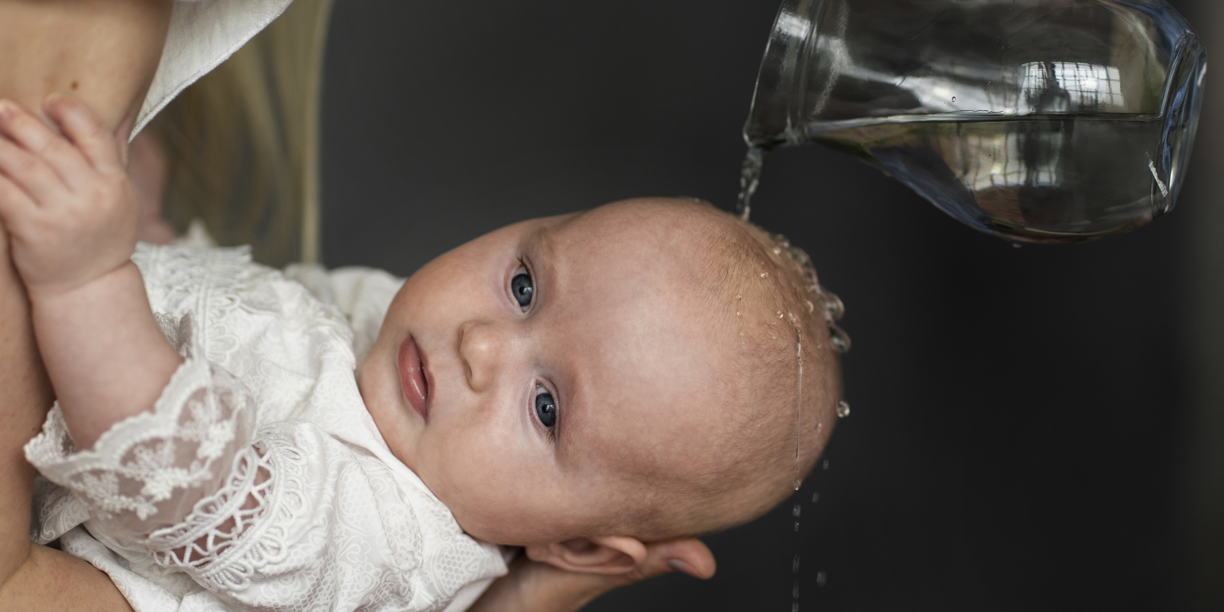 A baby at a christening | Source: Freepik