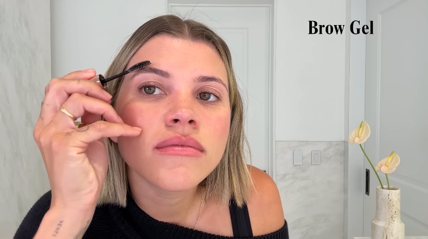 Sofia Richie doing her beauty routine from a video dated July 25, 2025. | Source: YouTube/Vogue