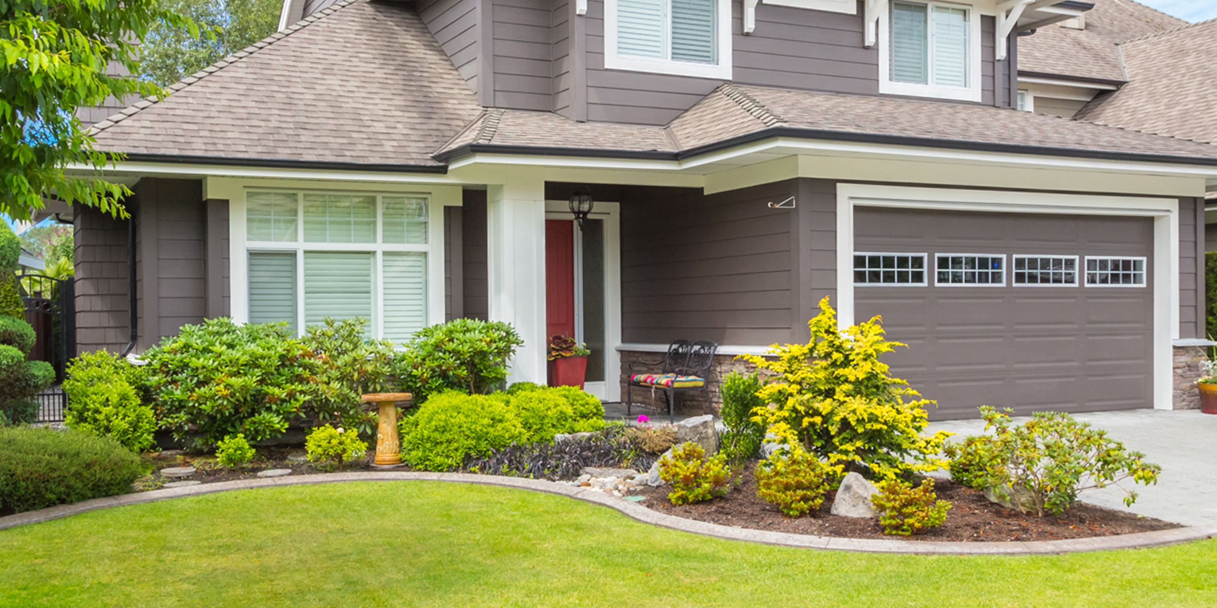 A house with a beautifully landscaped garden | Source: Shutterstock