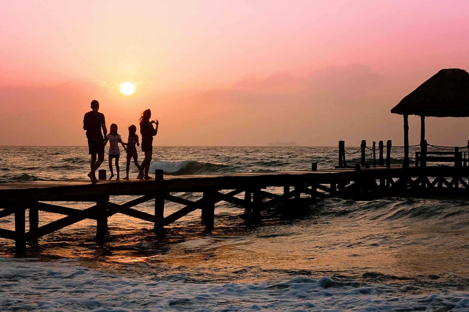 A family standing on a dock | Source: Pexels