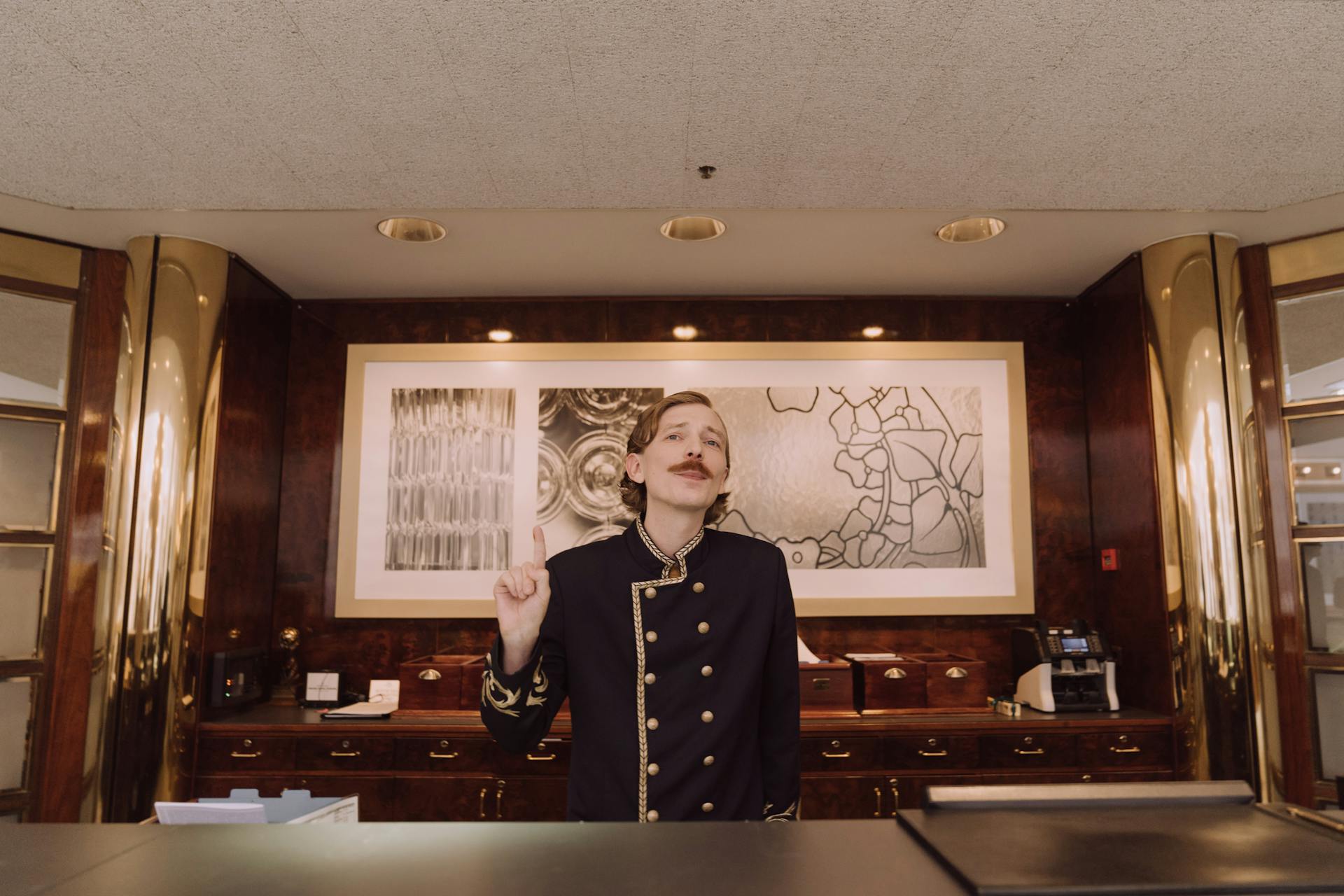 A male receptionist at the front desk | Source: Pexels