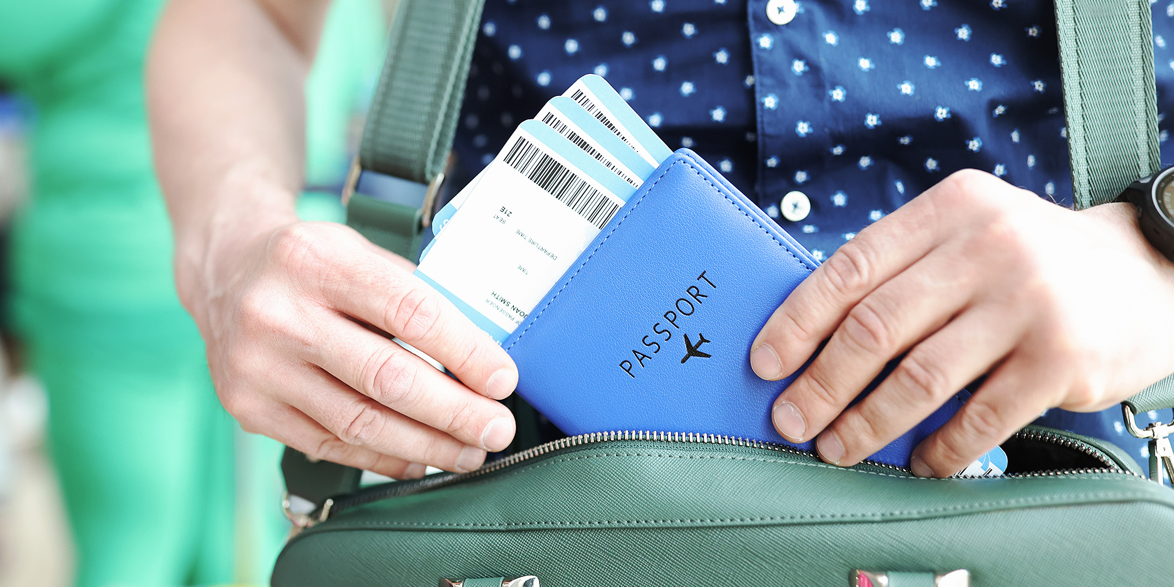 A person holding a boarding pass and passport | Source: Shutterstock