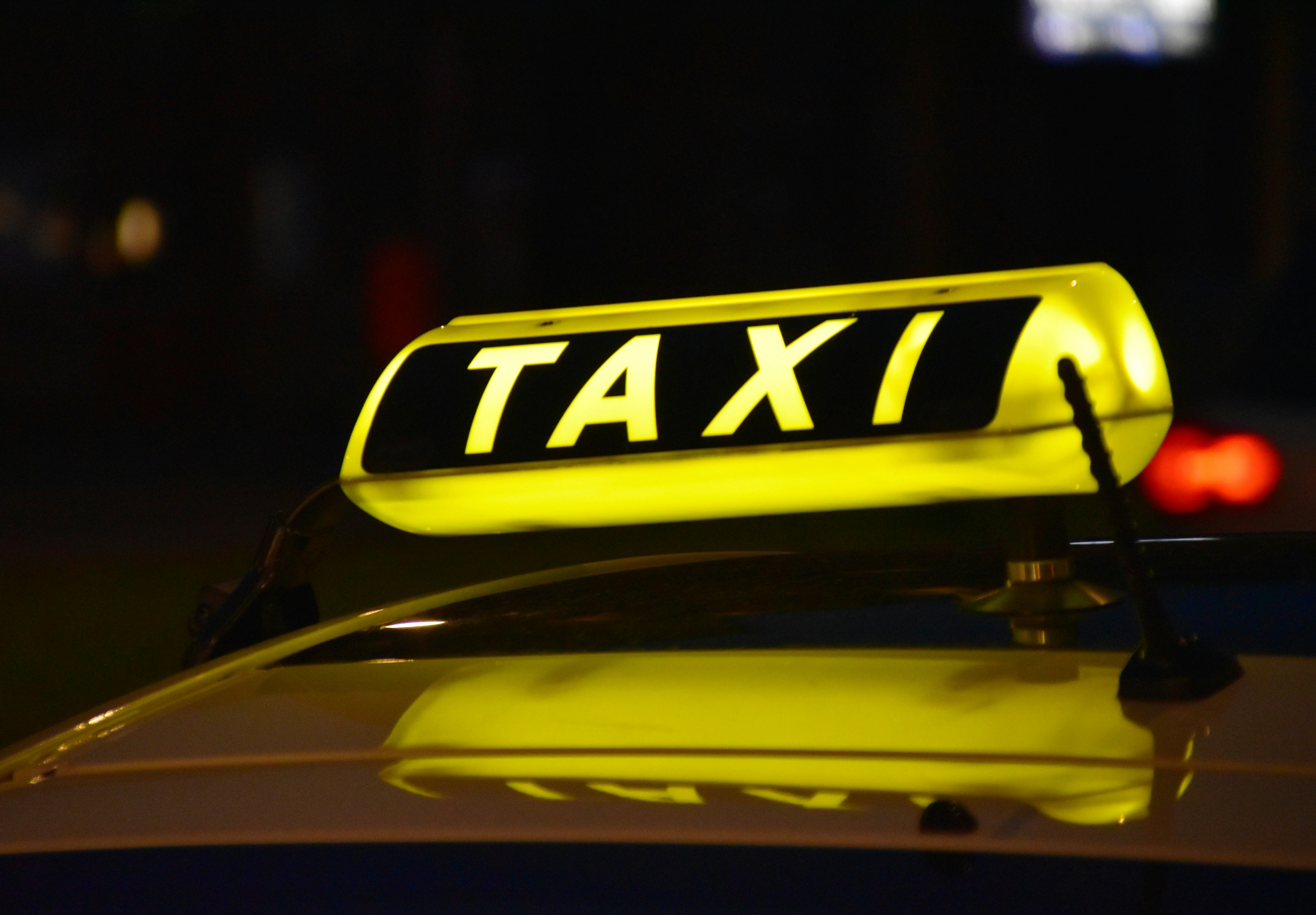 A neon light on a cab | Source: Unsplash
