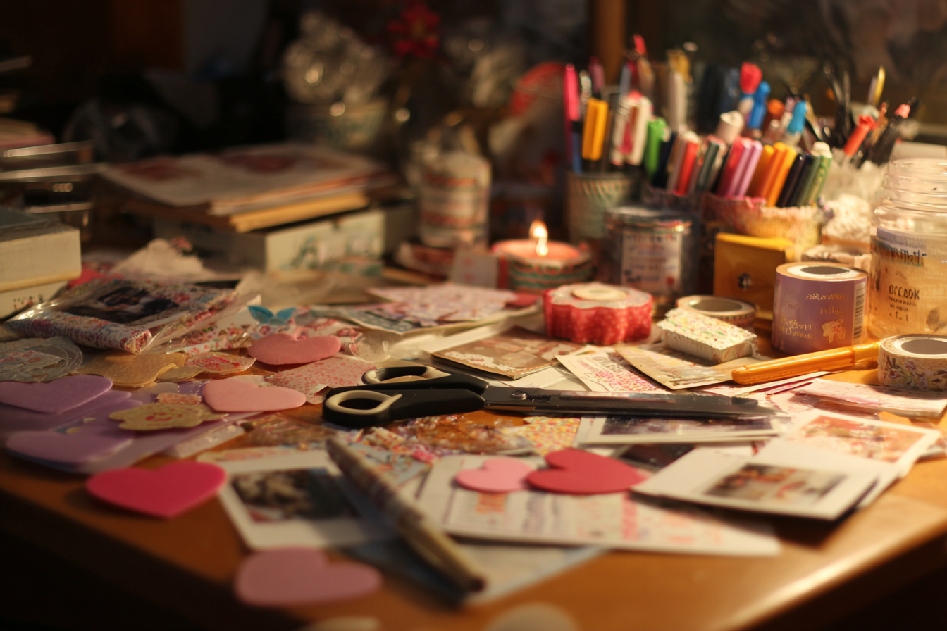 Scrapbook supplies on a table | Source: Midjourney