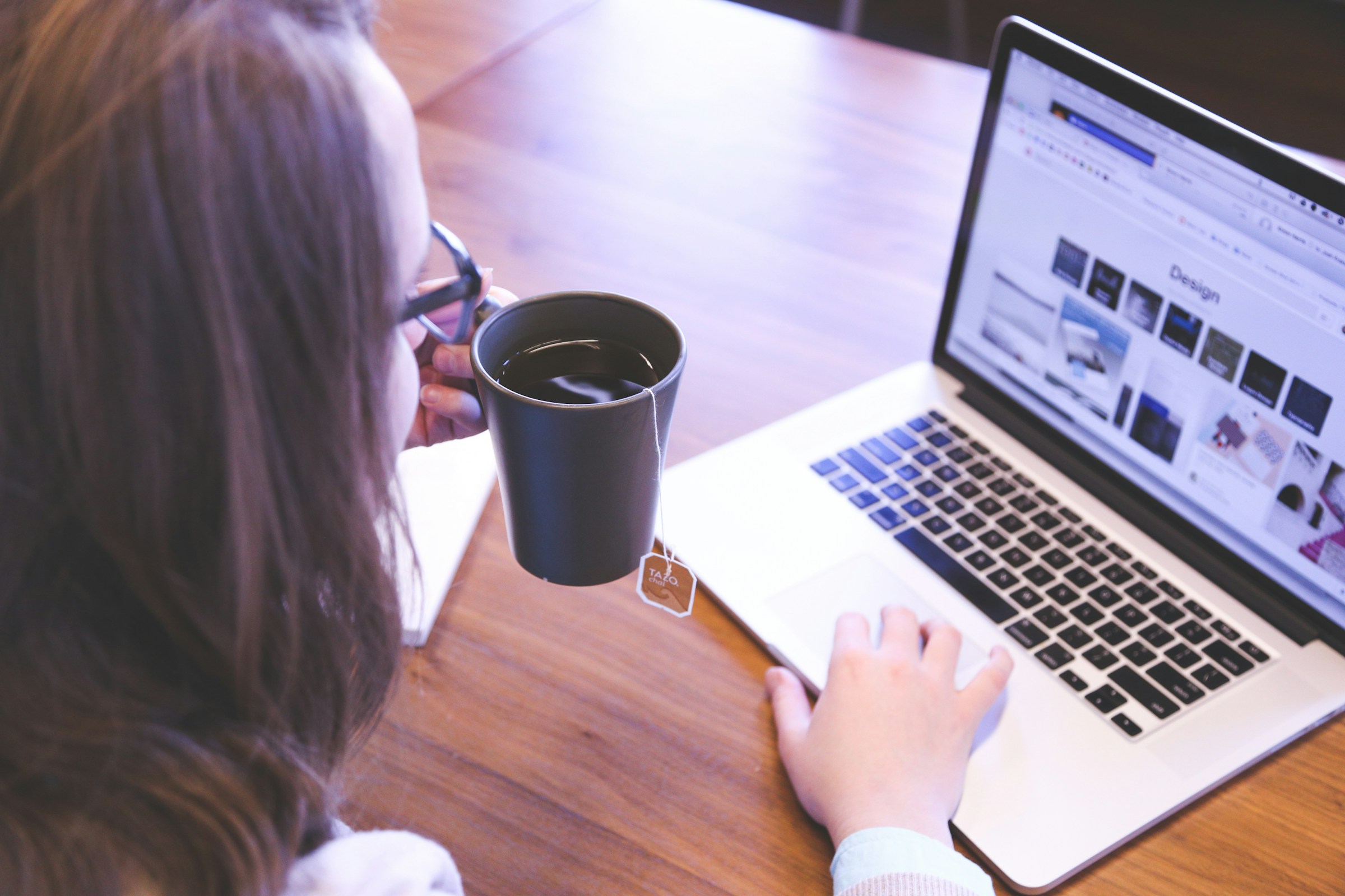 A woman sitting with a laptop | Source: Unsplash