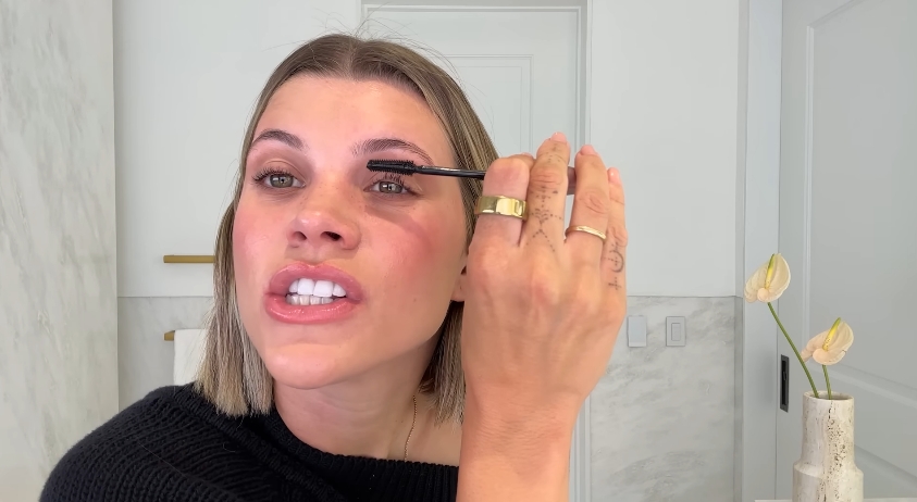 Sofia Richie doing her beauty routine from a video dated July 25, 2025. | Source: YouTube/Vogue