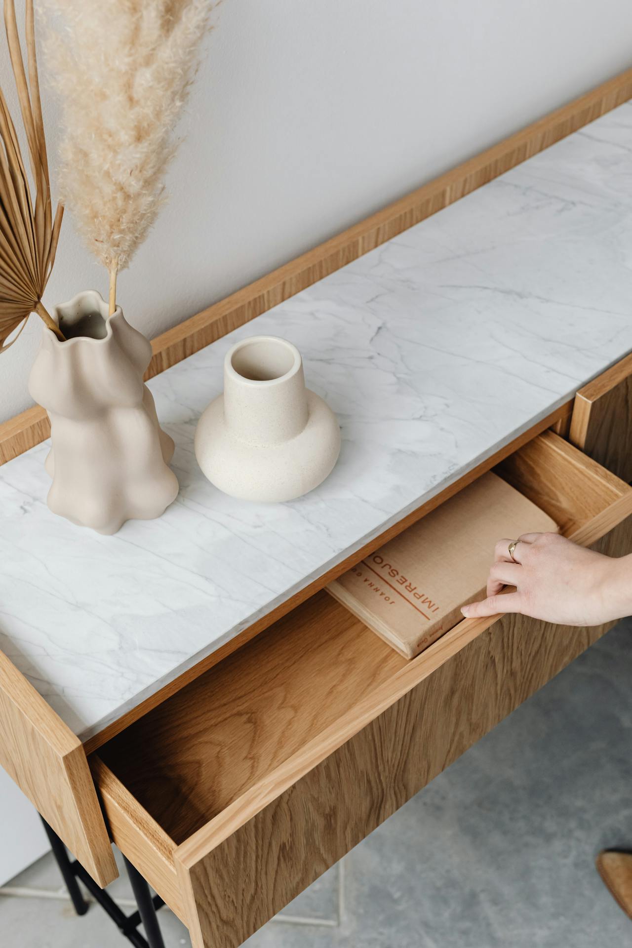 A woman opening a drawer | Source: Pexels