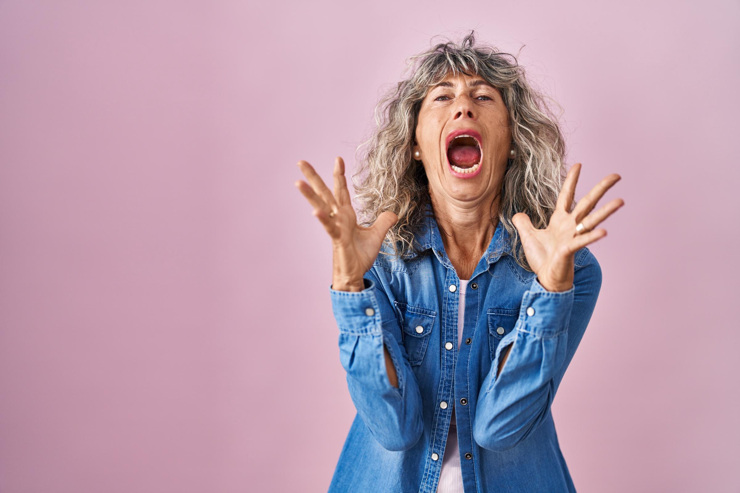 An angry woman shouting | Source: Freepik