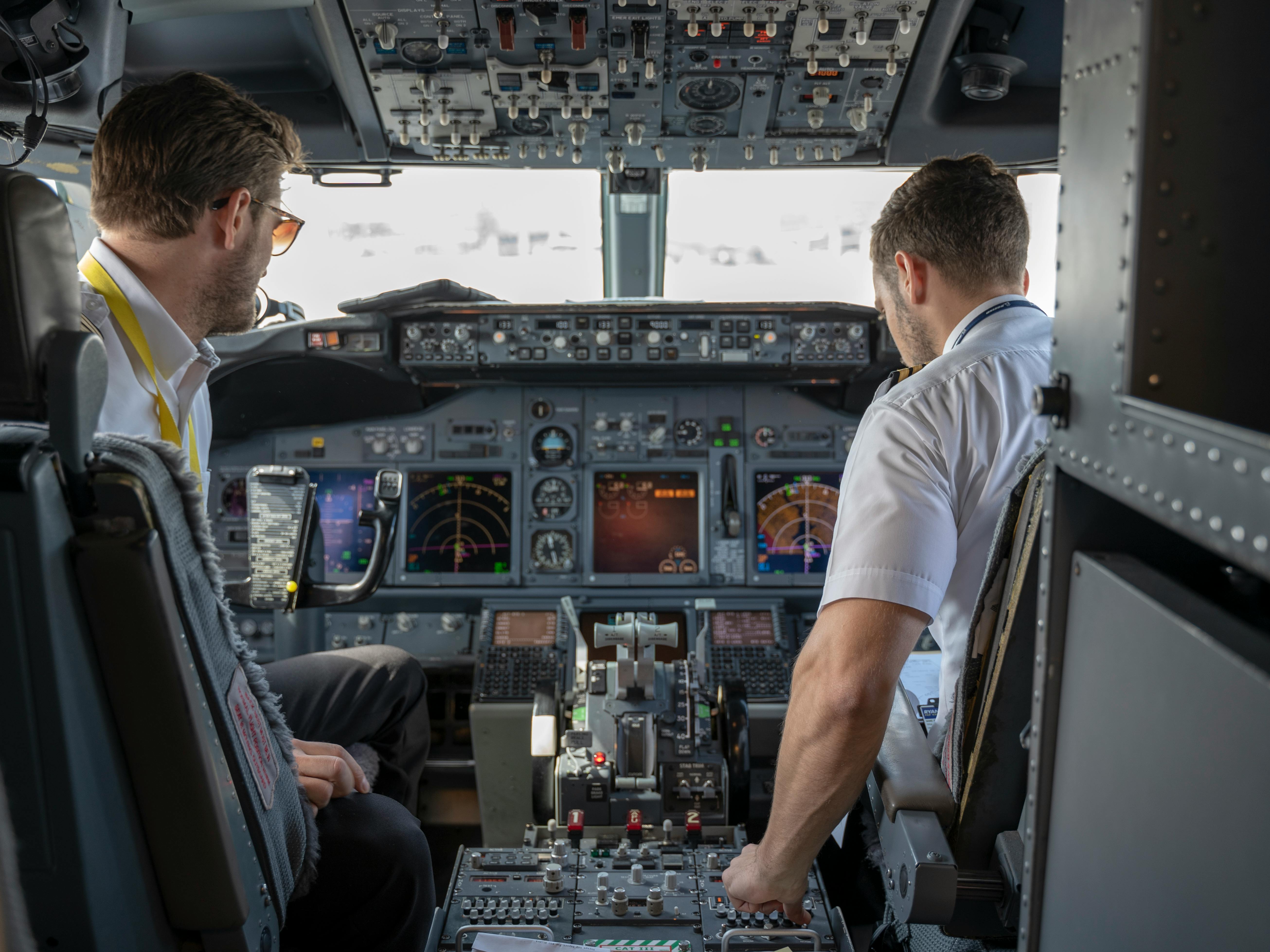 Two pilots inside the cockpit | Source: Pexels