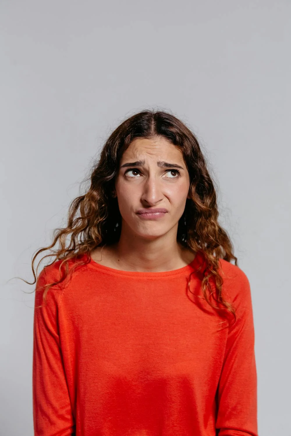 An annoyed woman rolling her eyes | Source: Pexels