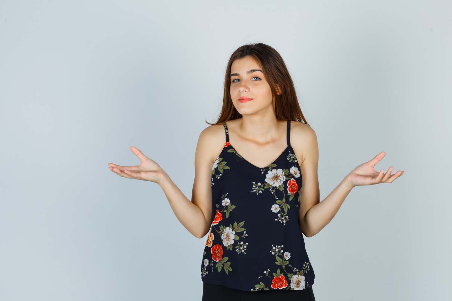 A woman shrugging | Source: Freepik