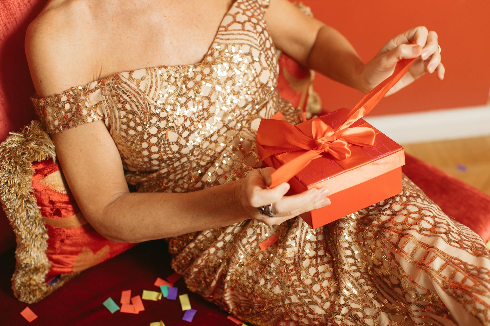 A close-up shot of a woman opening a gift | Source: Pexels