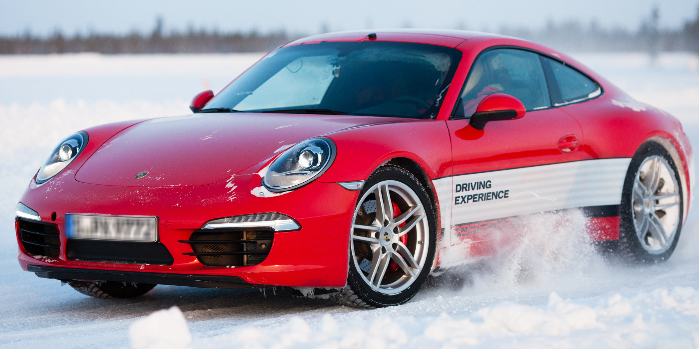 Carmine red Porsche Panamera parked on a winter street | Source: Shutterstock