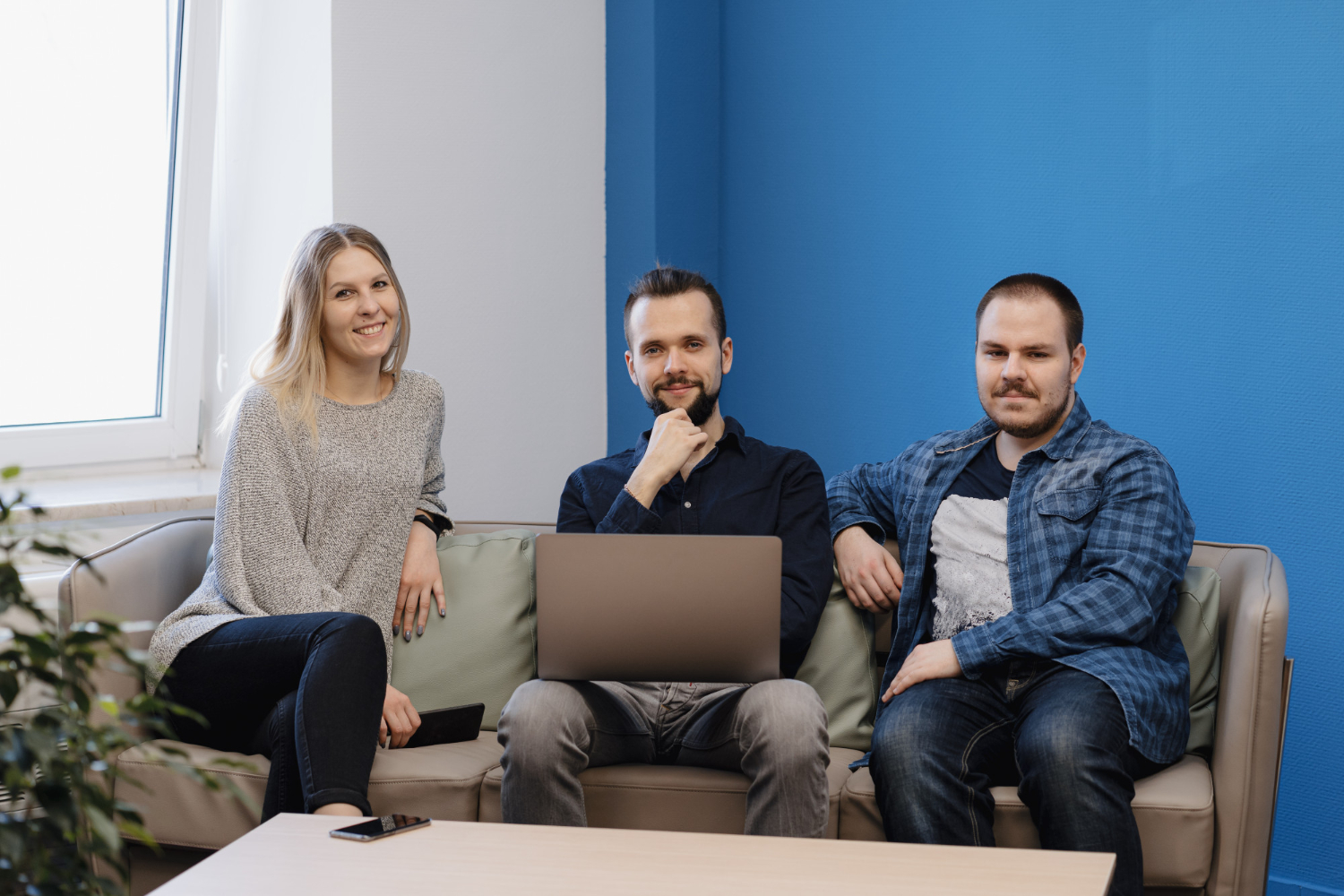 Three people sitting in an office | Source: Freepik