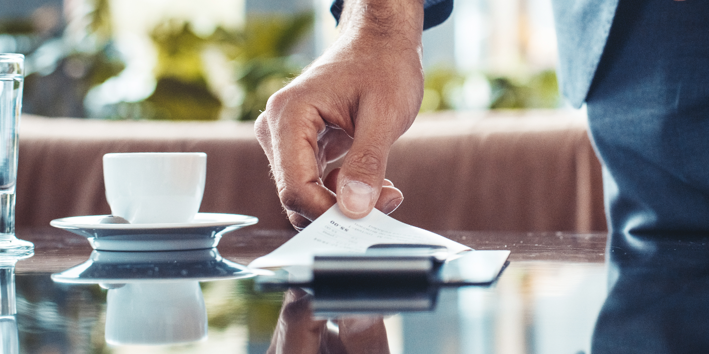 A restaurant bill on a table | Source: Shutterstock