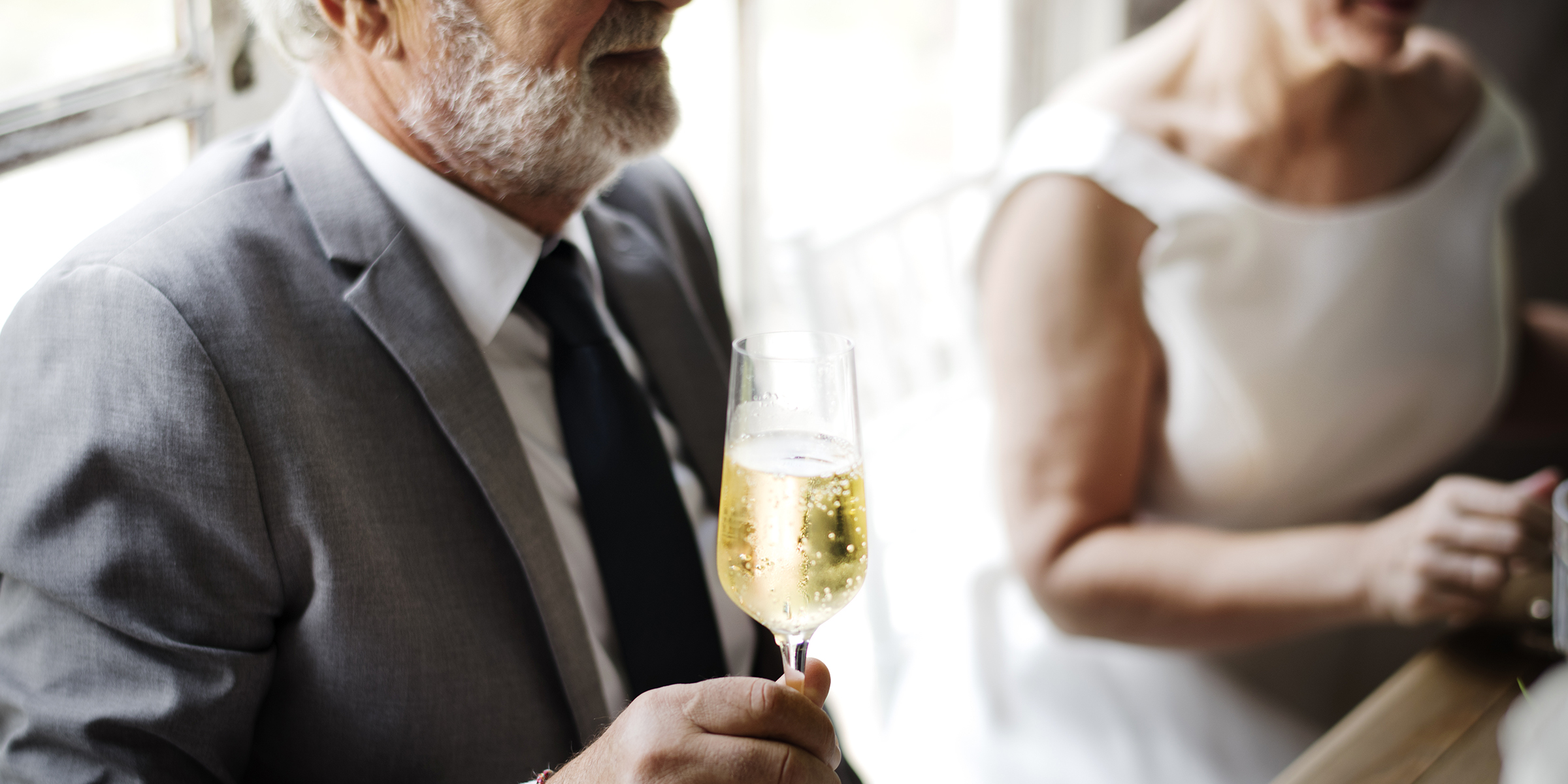 A man holding a flute of champagne | Source: Shutterstock