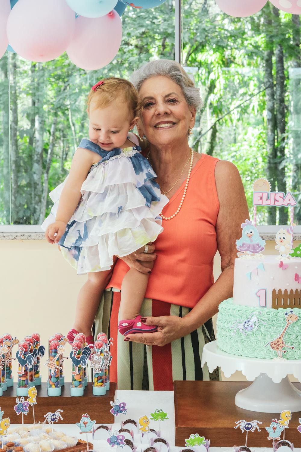 A grandmother holding her granddaughter | Source: Pexels