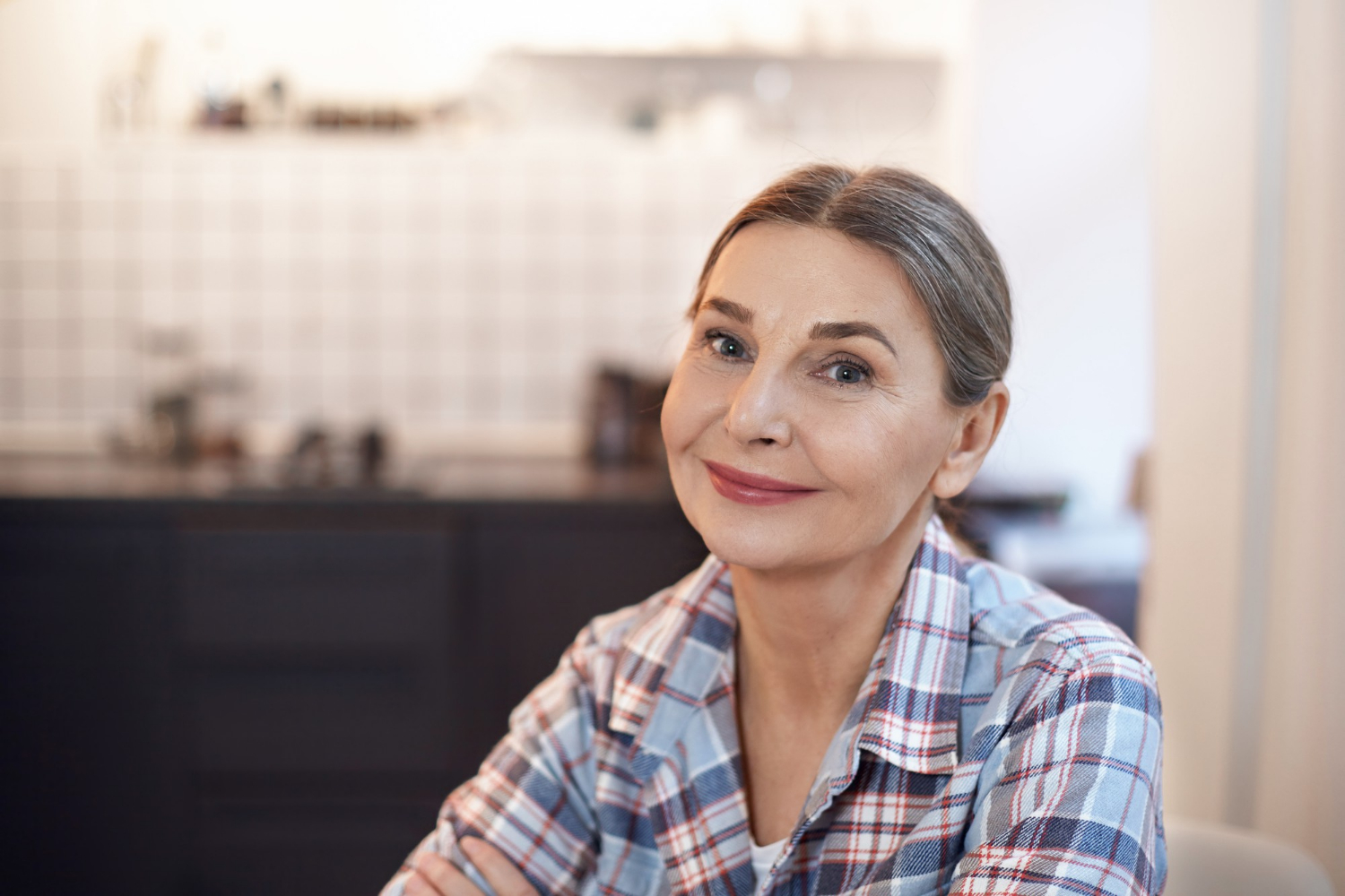 An older woman looking relieved | Source: Freepik