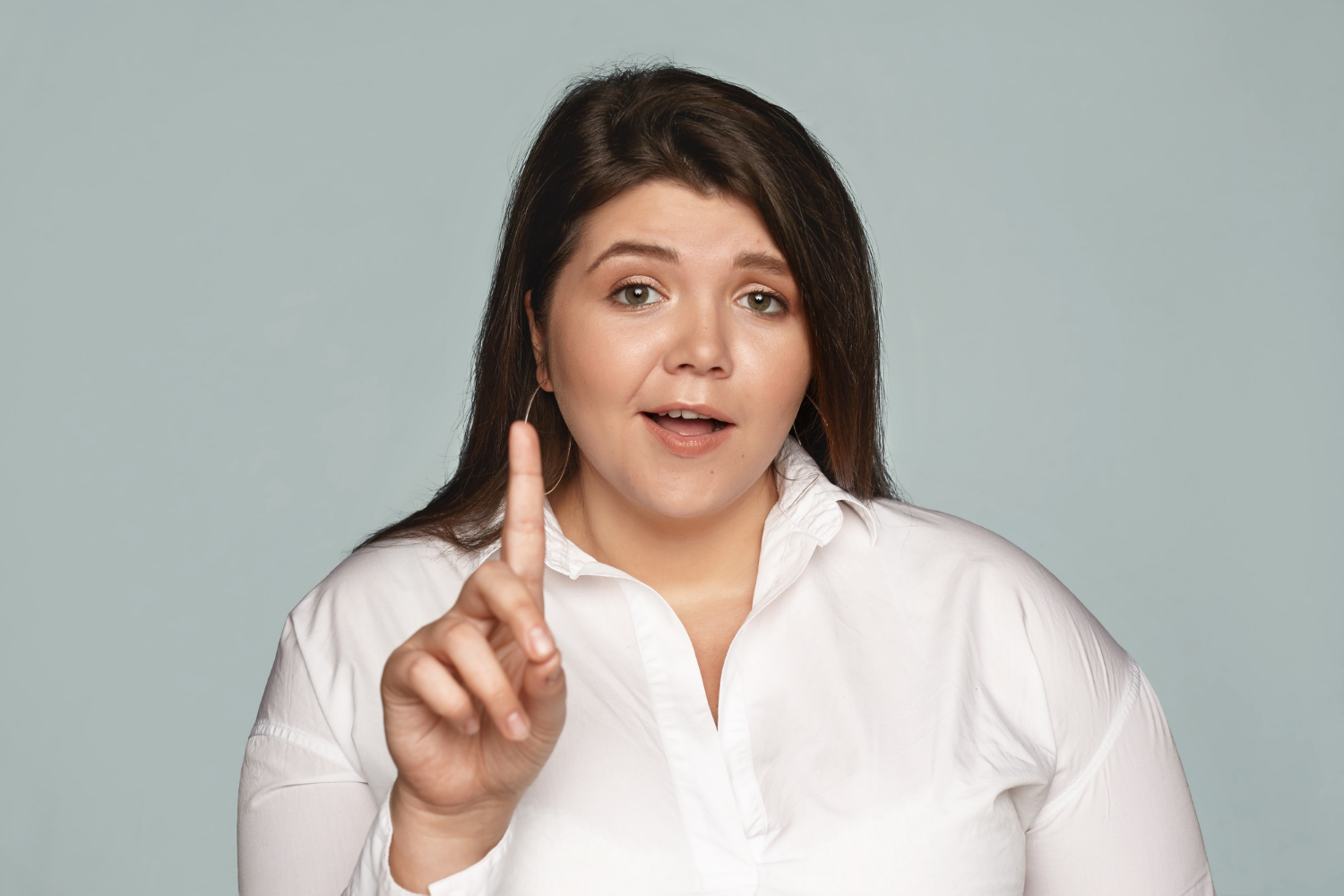 A woman gesturing her finger at someone | Source: Freepik