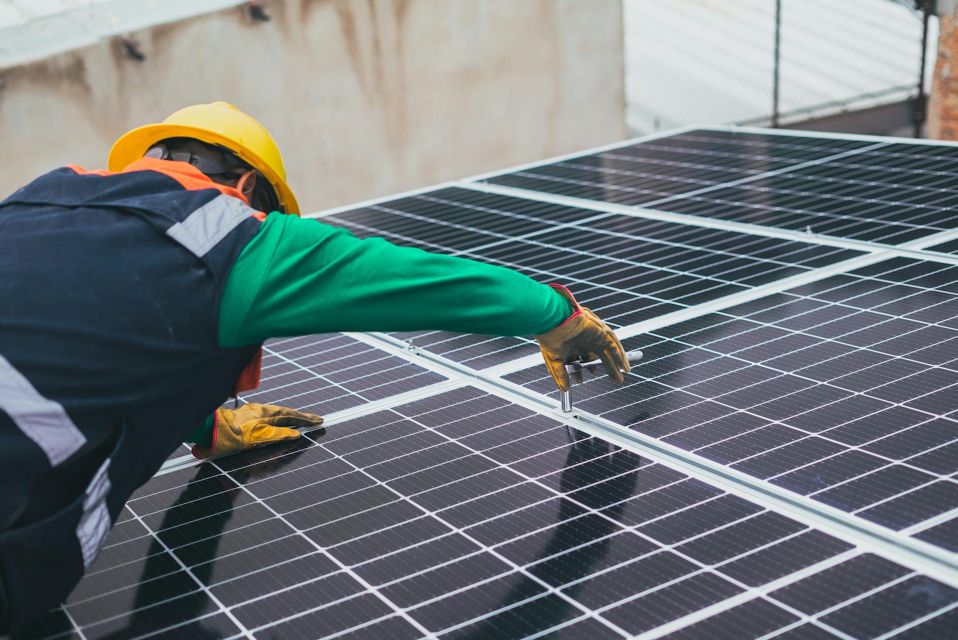 A man working on a solar panel | Source: Pexels