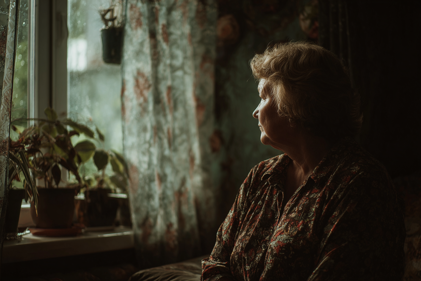 A woman sitting in her house | Source: Midjourney