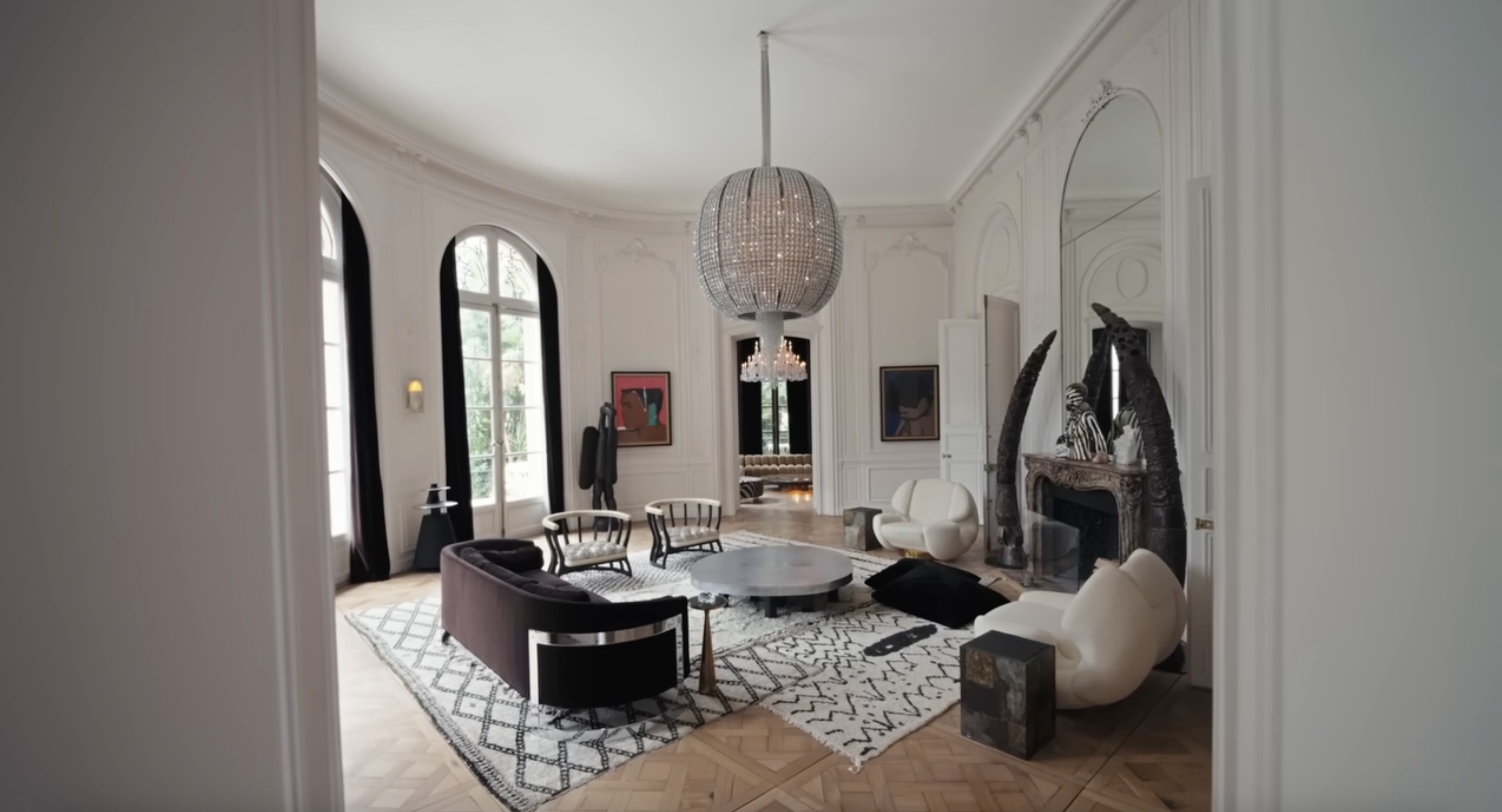 Lenny Kravitz's living area where he hosts guests, posted on April 15, 2025. | Source: YouTube/Architectural Digest