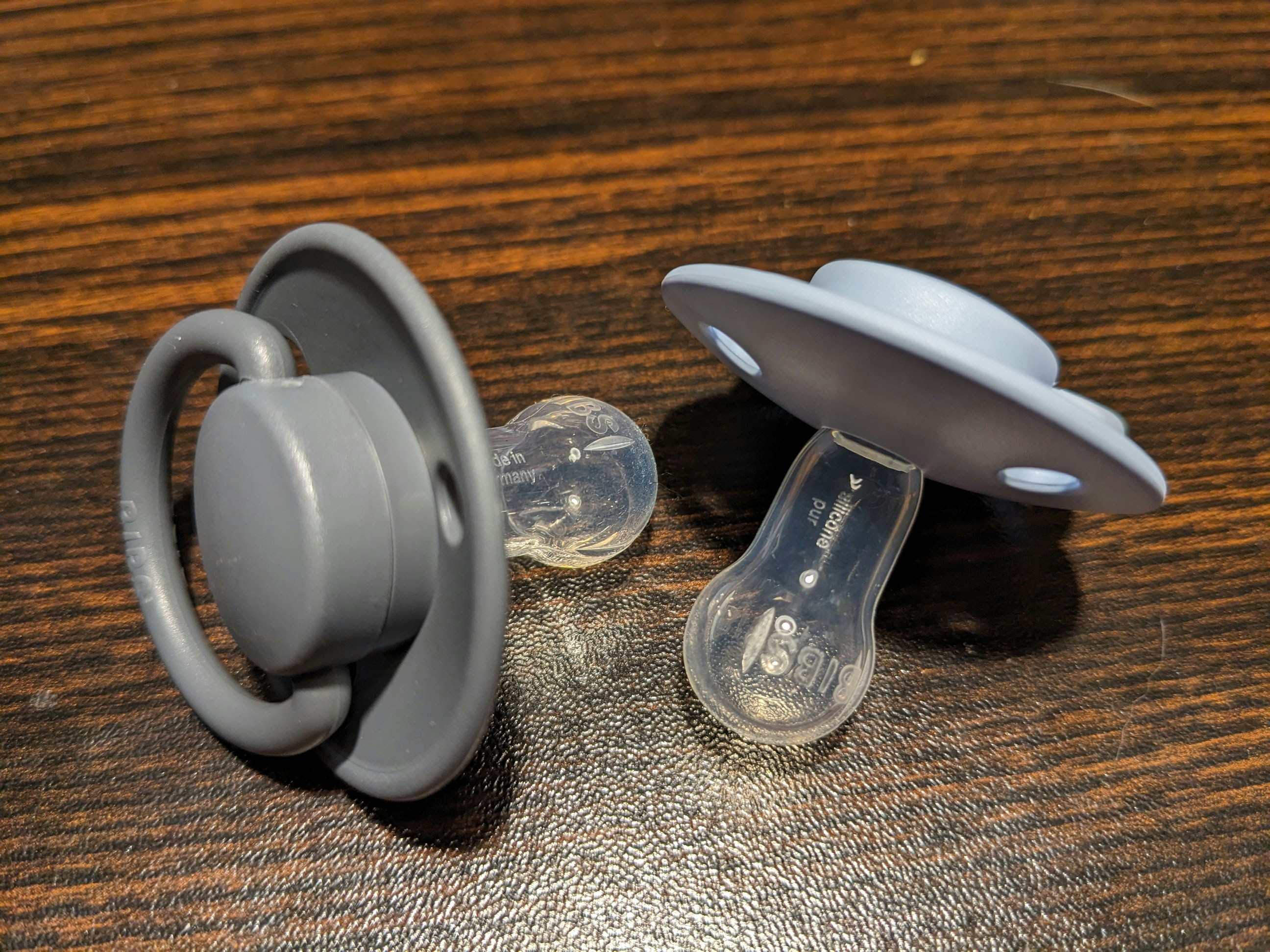 A pair of pacifiers on a table | Source: Unsplash