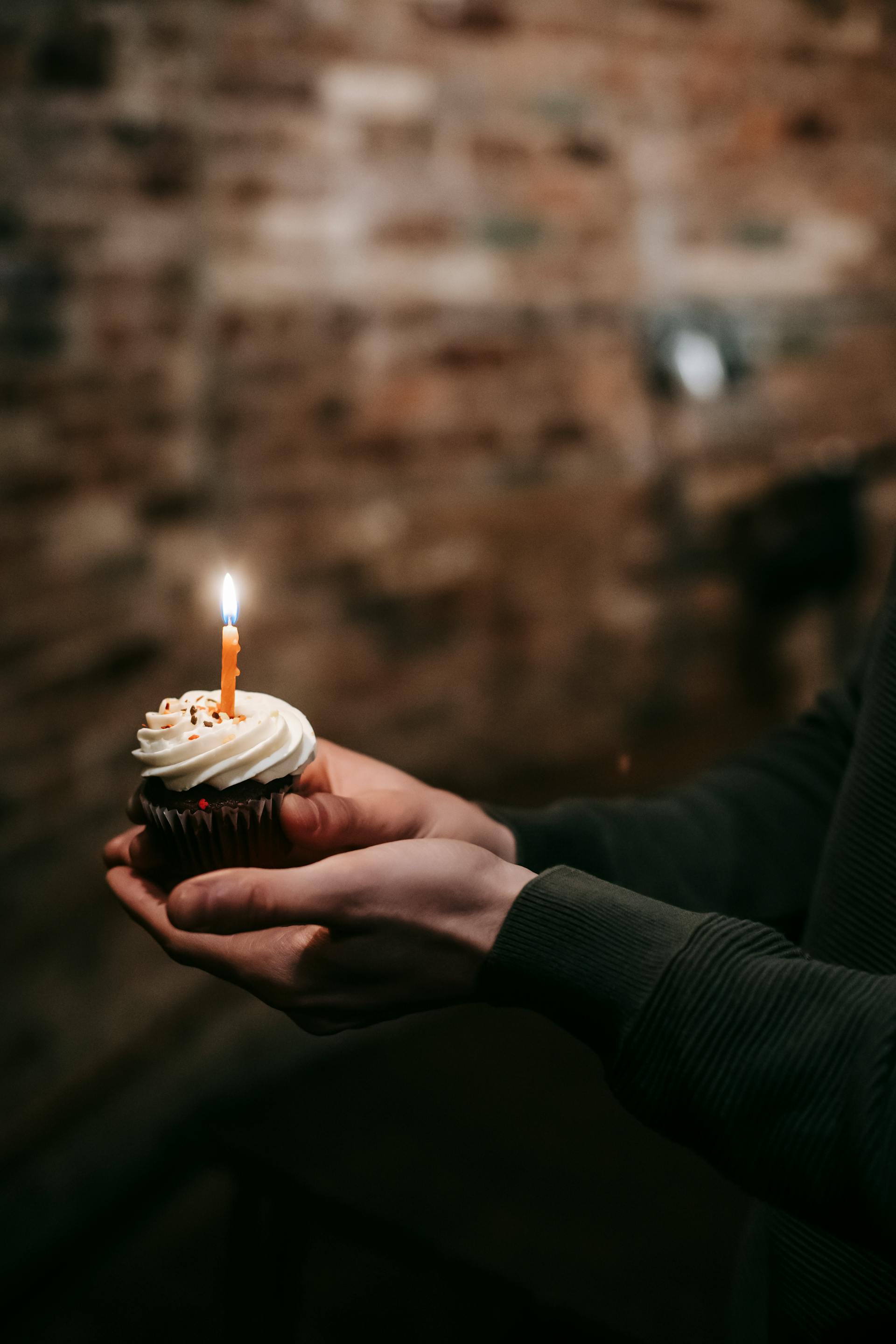 A person holding a cupcake on their birthday | Source: Pexels