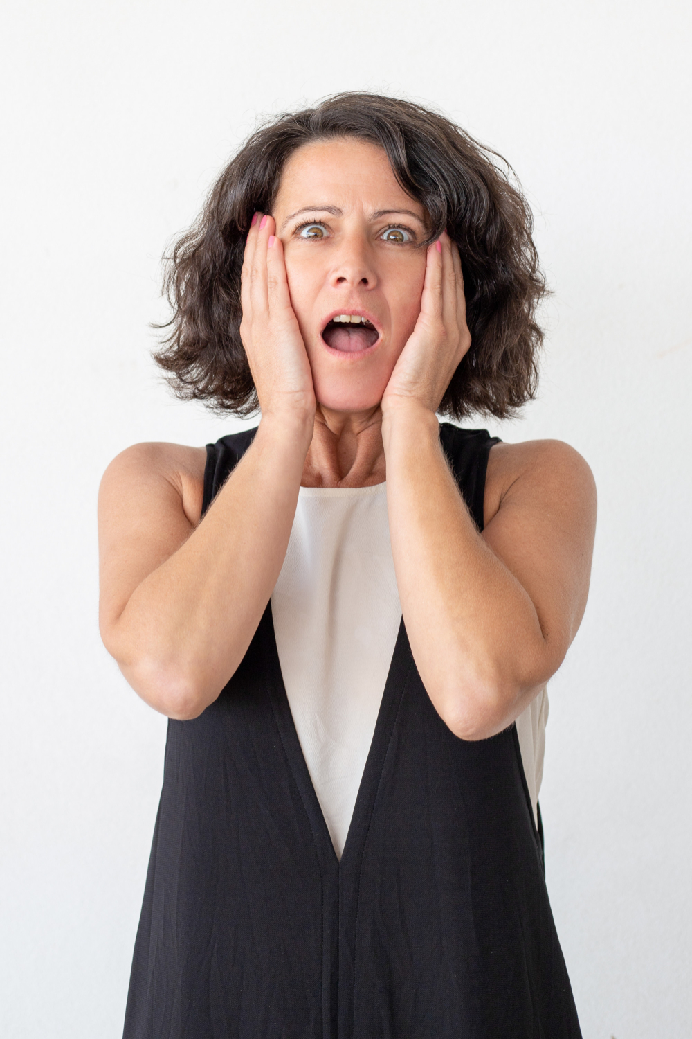 A stunned woman | Source: Freepik