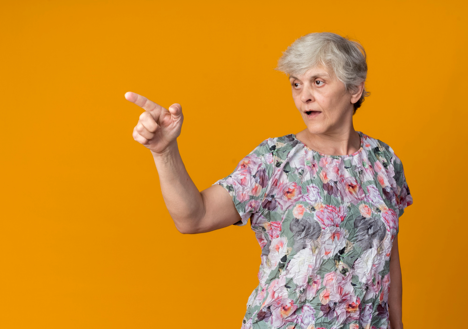 An elderly woman pointing her finger | Source: Freepik