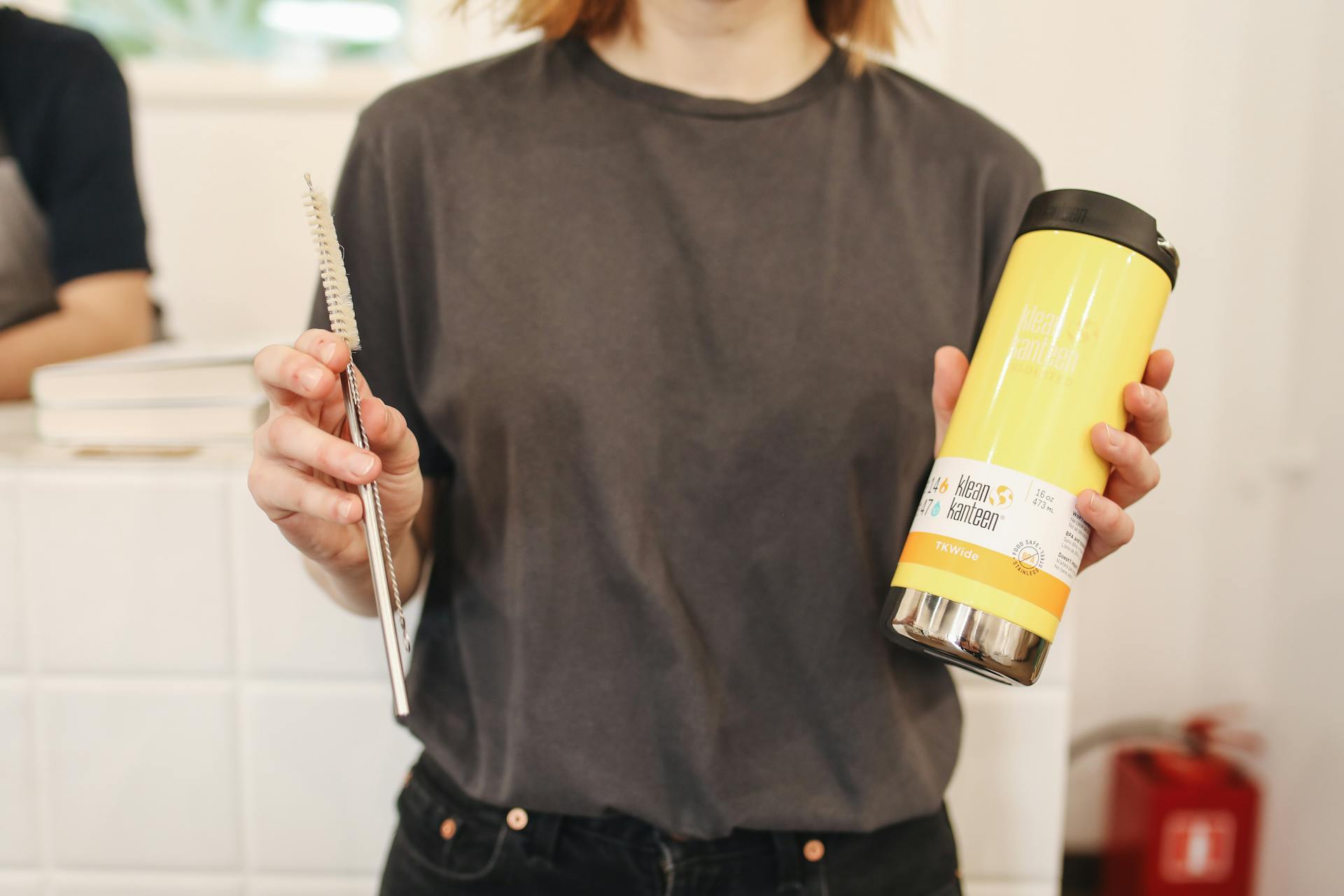 A woman holding a travel mug | Source: Pexels