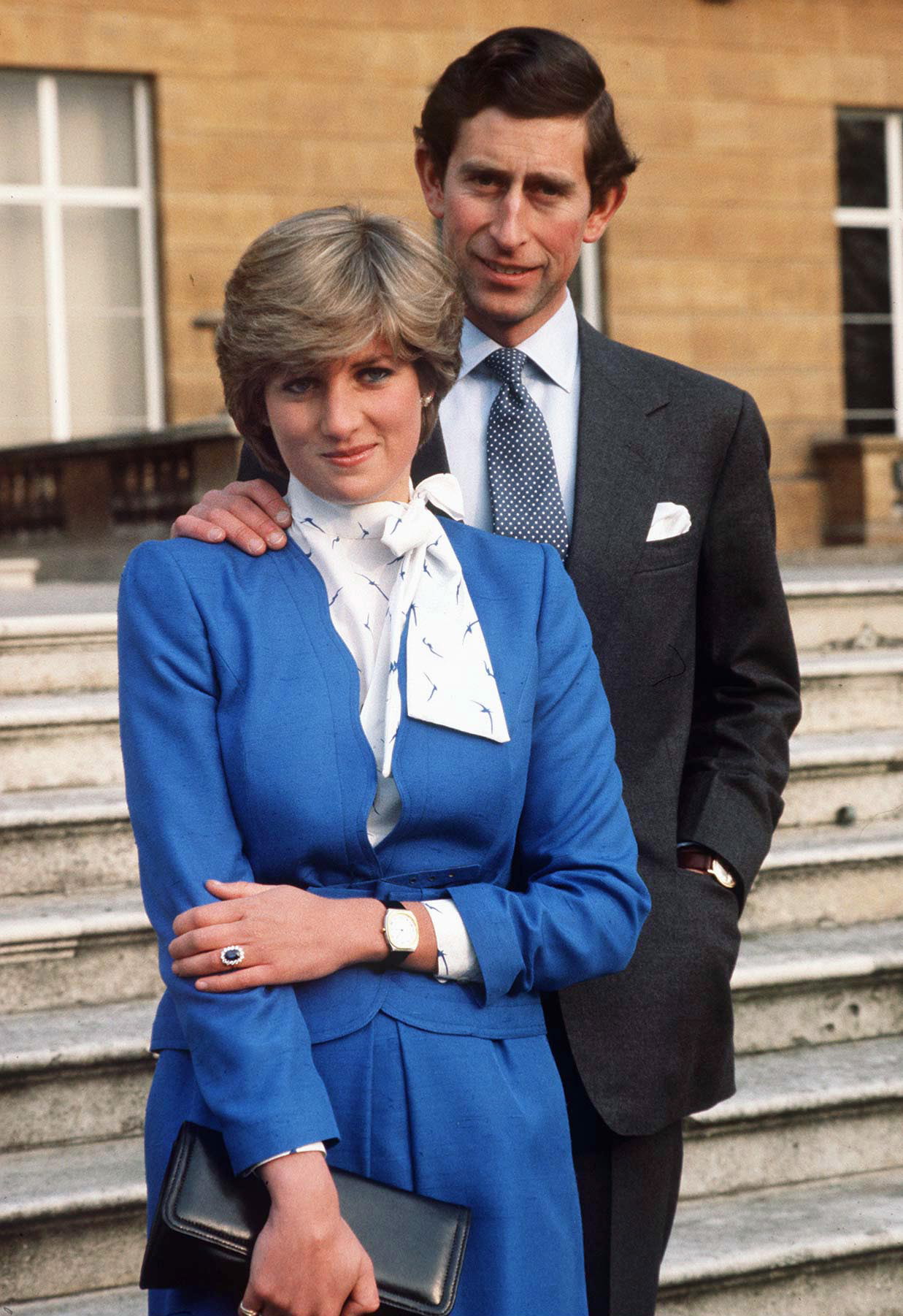 Lady Diana Spencer reveals her sapphire and diamond engagement ring while she and Prince Charles pose for photographs on the grounds of Buckingham Palace following the announcement of their engagement on February 21, 1981. | Source: Getty Images