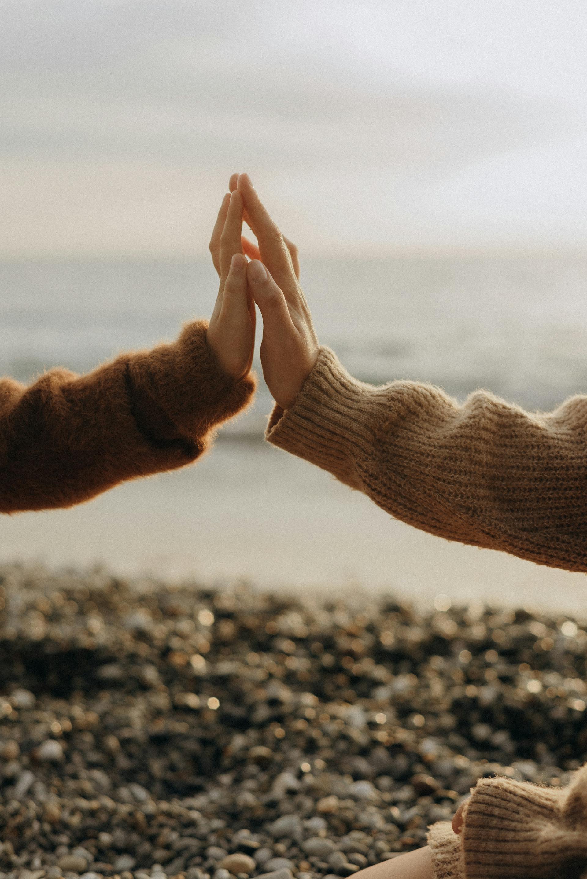 A woman and her daughter holding hands | Source: Pexels