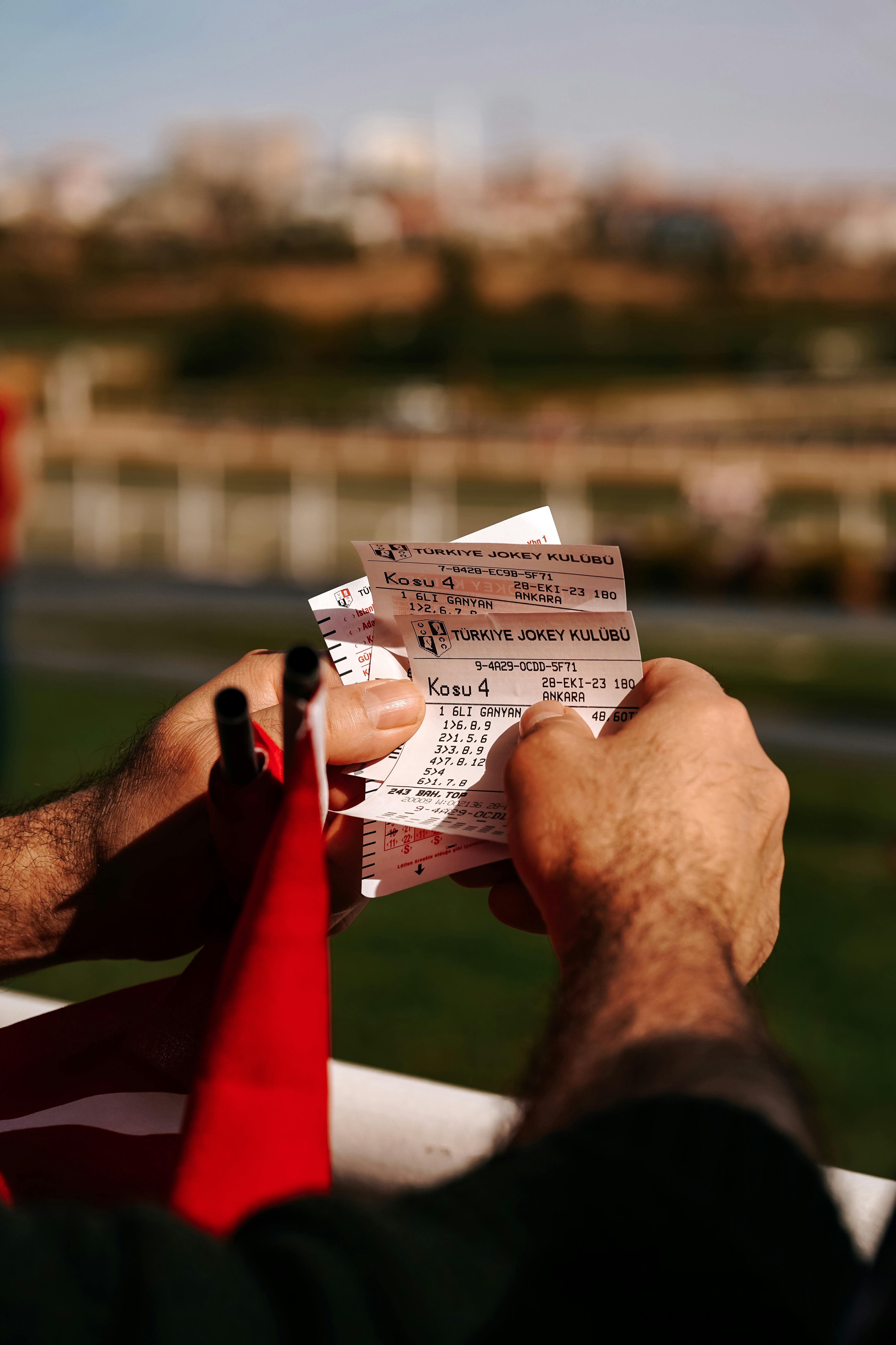 A person holding tickets | Source: Pexels
