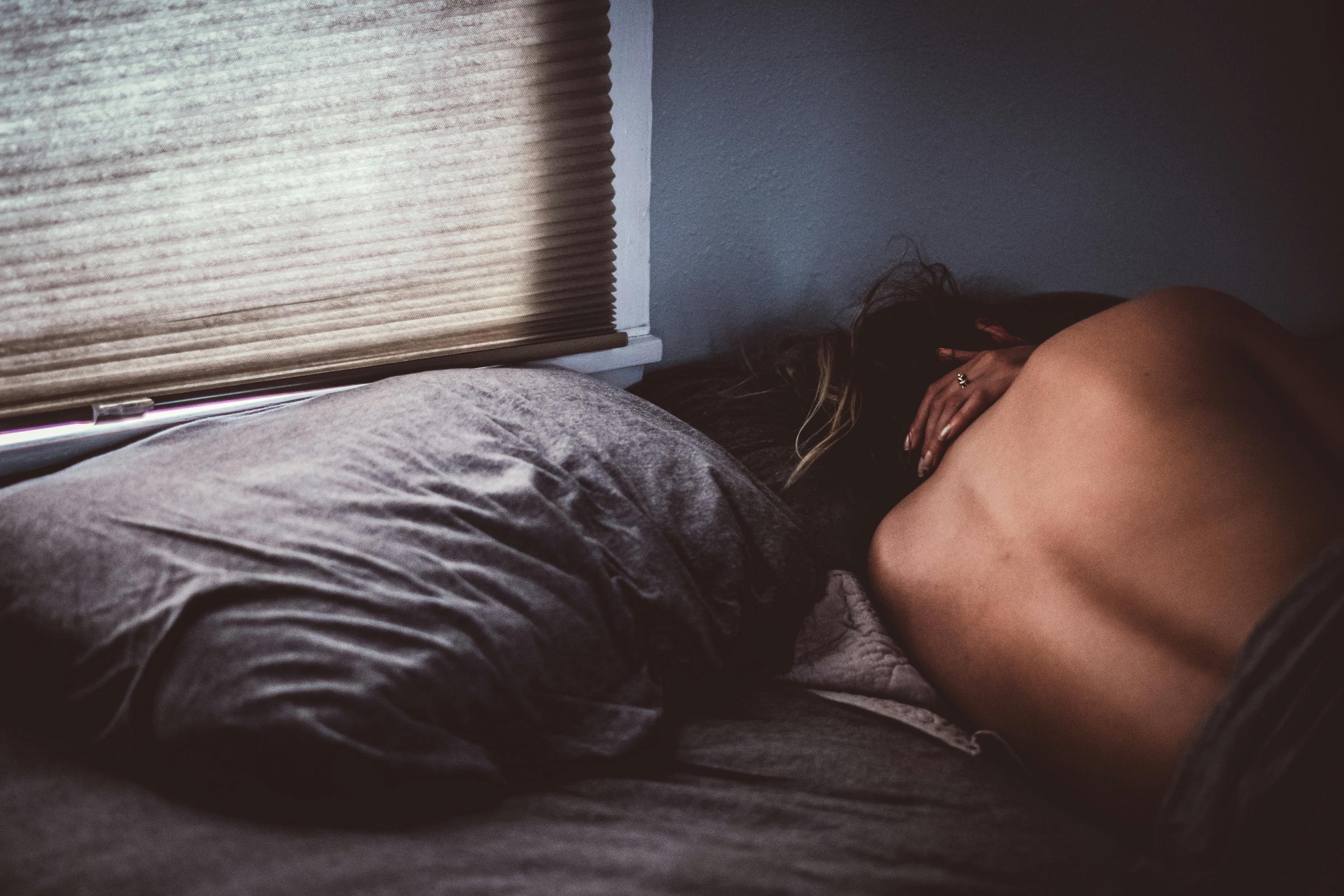 A sad woman in her apartment | Source: Unsplash